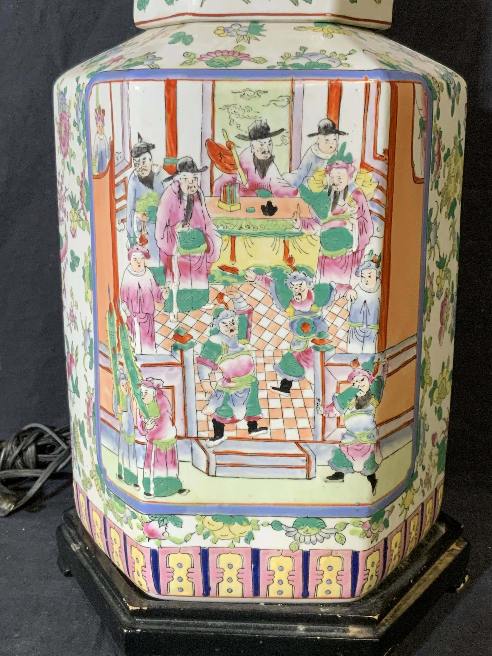 Hand Painted Chinese Porcelain Lamp: Hand Painted Chinese porcelain lamp, black painted wooden base to lamp, label to underside reads ‘Made in China’, finial to top of harp of lamp designed as a lotus flower, no lamp shade, measures 