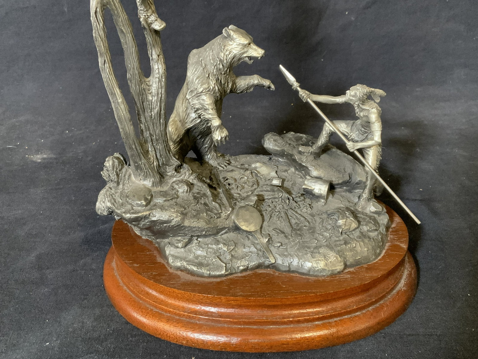 JJ BARNUM Chilmark 1987 Pewter Sculpture: JJ Barnum Chilmark 1987 Pewter Sculpture, underside of piece reads ‘ CHILMARK 1987 "TREED" FINE PEWTER SCULPTURE BY JJ BARNUM’, wooden base to piece, sculpture made entirely of pewter, subject two