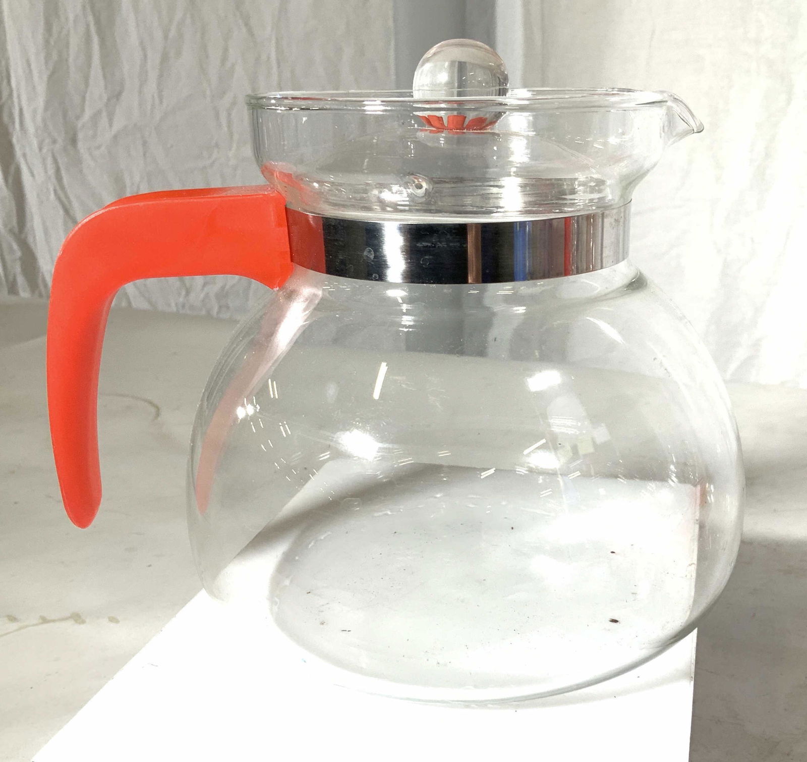 Glass Drip Style Coffee Pot,Lid, Decaf C. Handle: Glass coffee or tea pot with glass lid, Holds app 8 cups and has the plastic red handle identifying decaffeinated coffee. Pot 6.5 in. Wide, 6 in ht. Properly of Multi Generation Brooklyn Collector’s