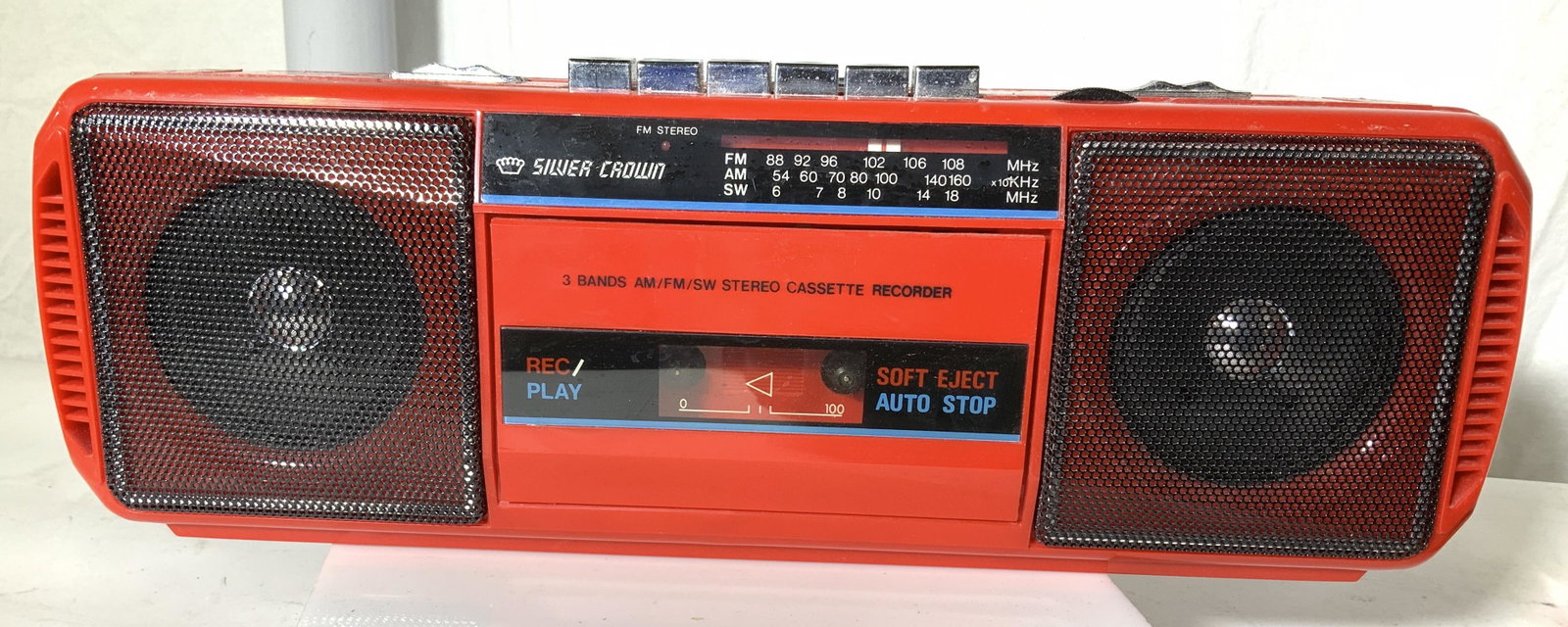 Silver Crown Model MK-37 Cassette Record. Radio: Portable boom box style cassette recorder and FM / AM radio with metal antenna, red, with handle to candle, vol control, switch for cassette to radio, microphone, battery operated 4 D batteries. Measu
