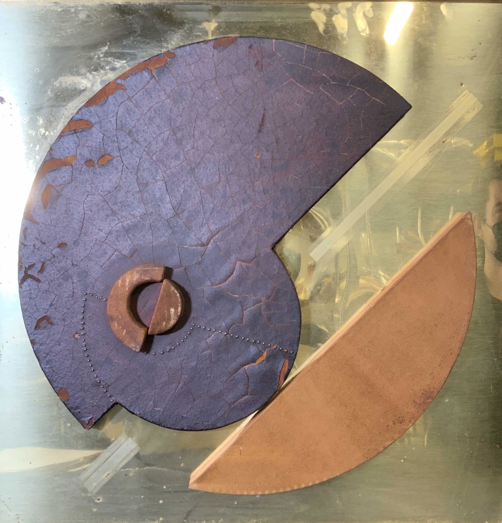 Abstract Leather Sculptural Relief on Brass Art: Abstract leather sculptural relief, no apparent inscriptions or signatures, text to reverse gives information on hanging and cleaning instructions, subject consists of two geometric bodies with additi