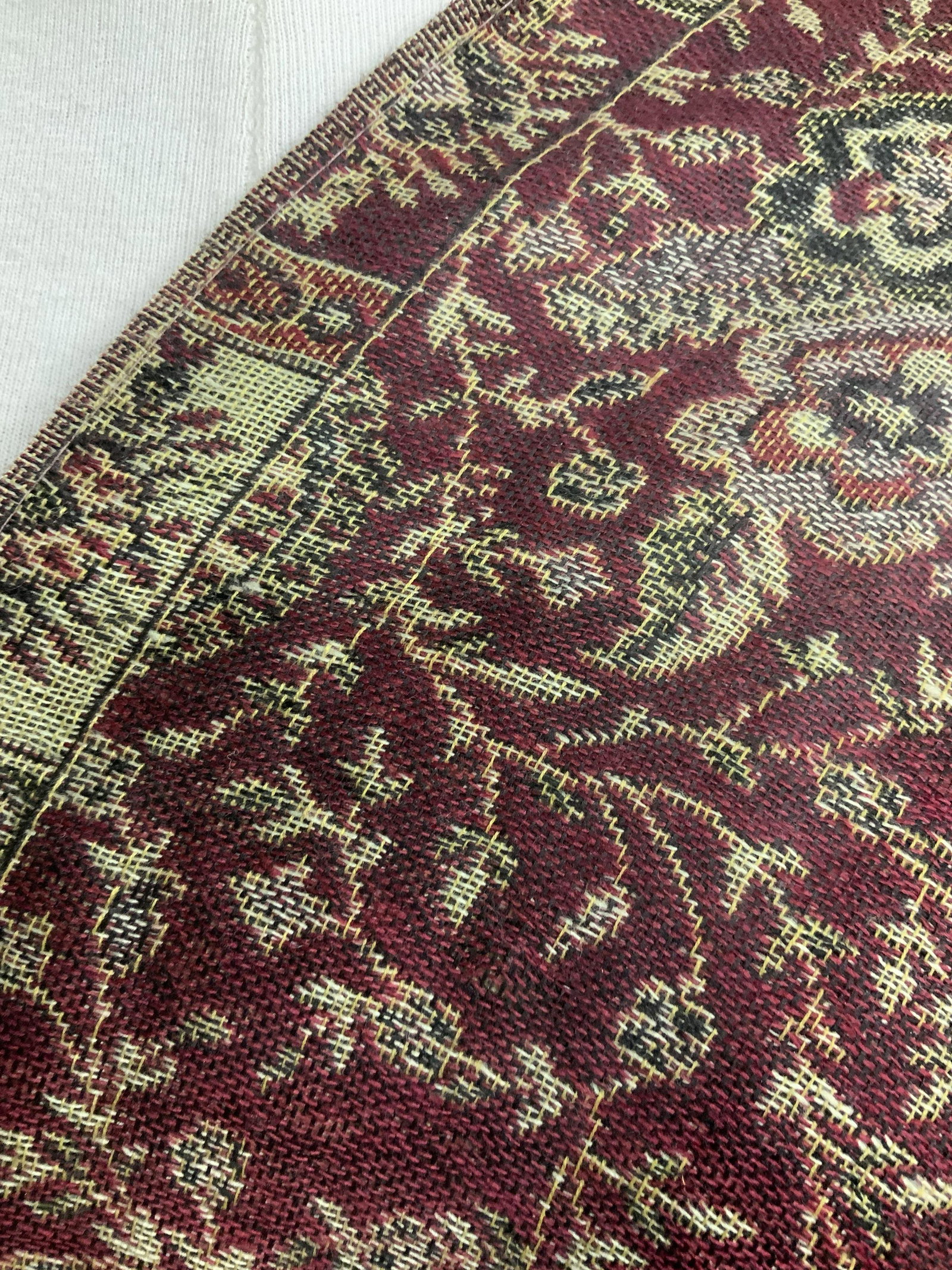 Middle Eastern Pashmina and Silk Shawl: Woven shawl, soft hand, with sewn attached label that reads PASHMINA, 55%PASHMINA, 45%SILK. Braided end tassels. Paisley design, red and beige coloring. 28 x 70 in. Section where there is a pull to th