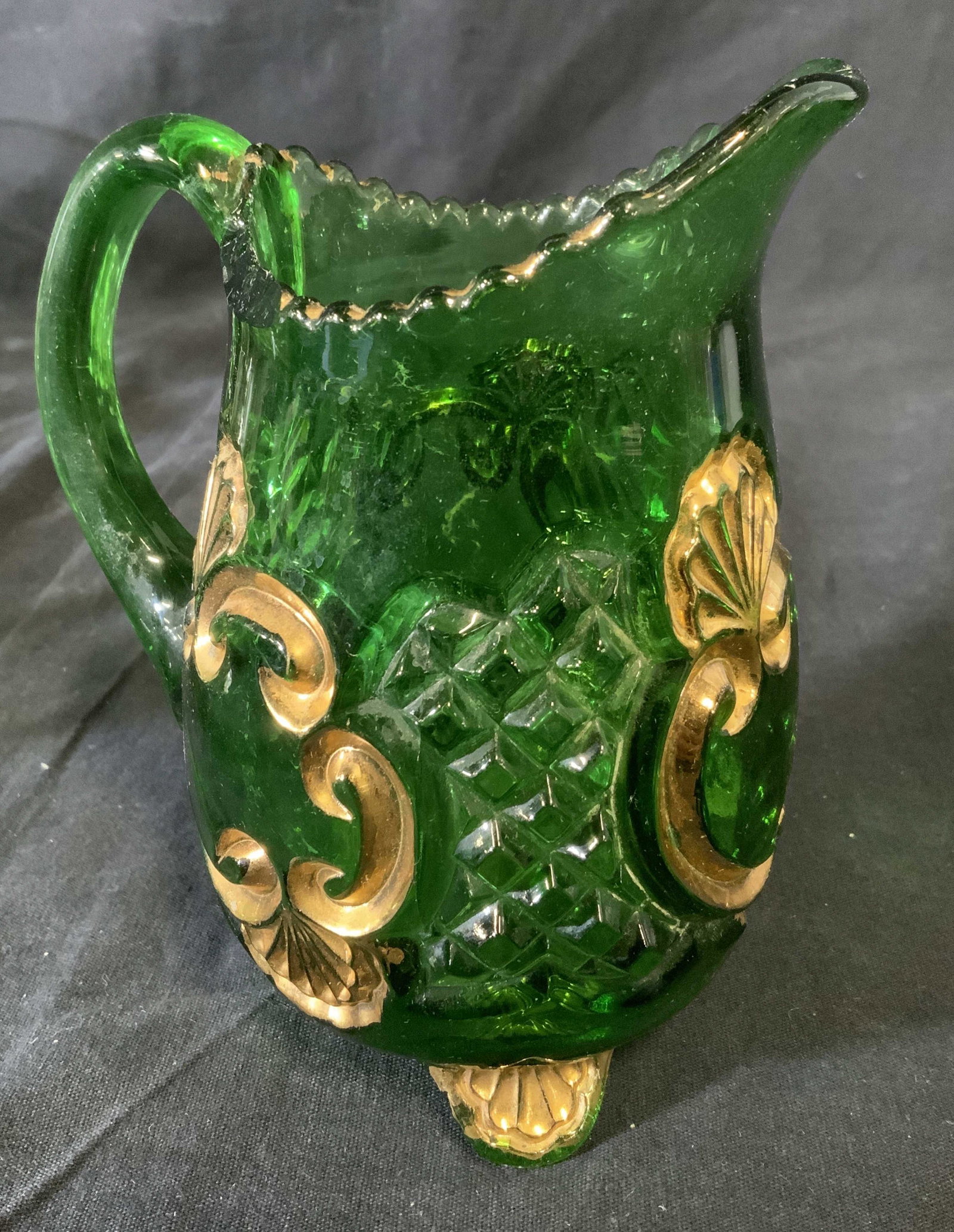 Lot 12 Depression Glass Cups & Others: Lot of twelve glasses and accessories, several of which are depression era glasses. Includes a cut glass pitcher, 7 drinking glasses, 2 shot glasses, a juicer, and a measuring glass. Largest glass mea