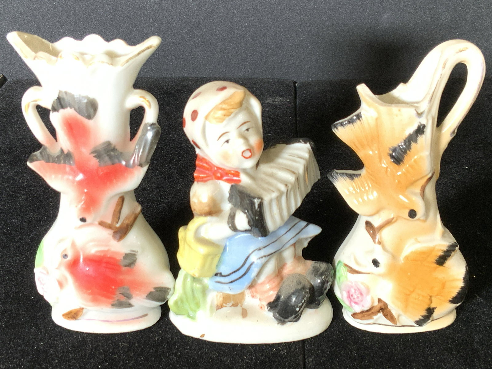 Lot 3 Vintage Porcelain Figural & Bud Vases, Japan: Two white porcelain bud vases and one white porcelain figural. Each piece features hand painted designs. Bud vases have gilt accents. Each underside is stamped JAPAN or MADE IN OCCUPIED JAPAN. The fig