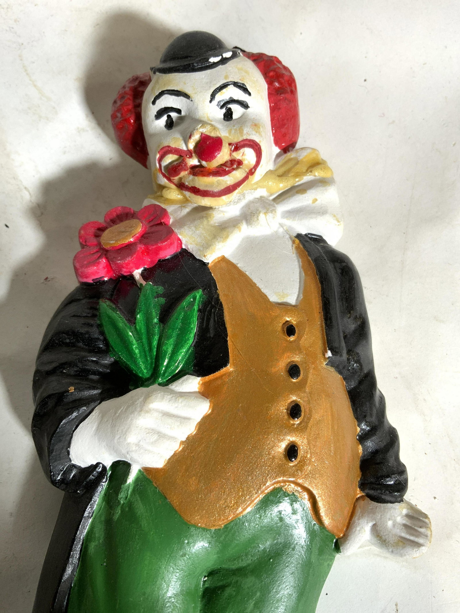 Vintage Plaster Hand Painted Clown Wall Hanging: Clown wall hanging is vintage & hand painted. Piece is plaster and has small hanging wire & magnet glued to backside. Piece measures approx 7.5 inches tall 3.5 inches wide. Wall hanging, plaster wall 