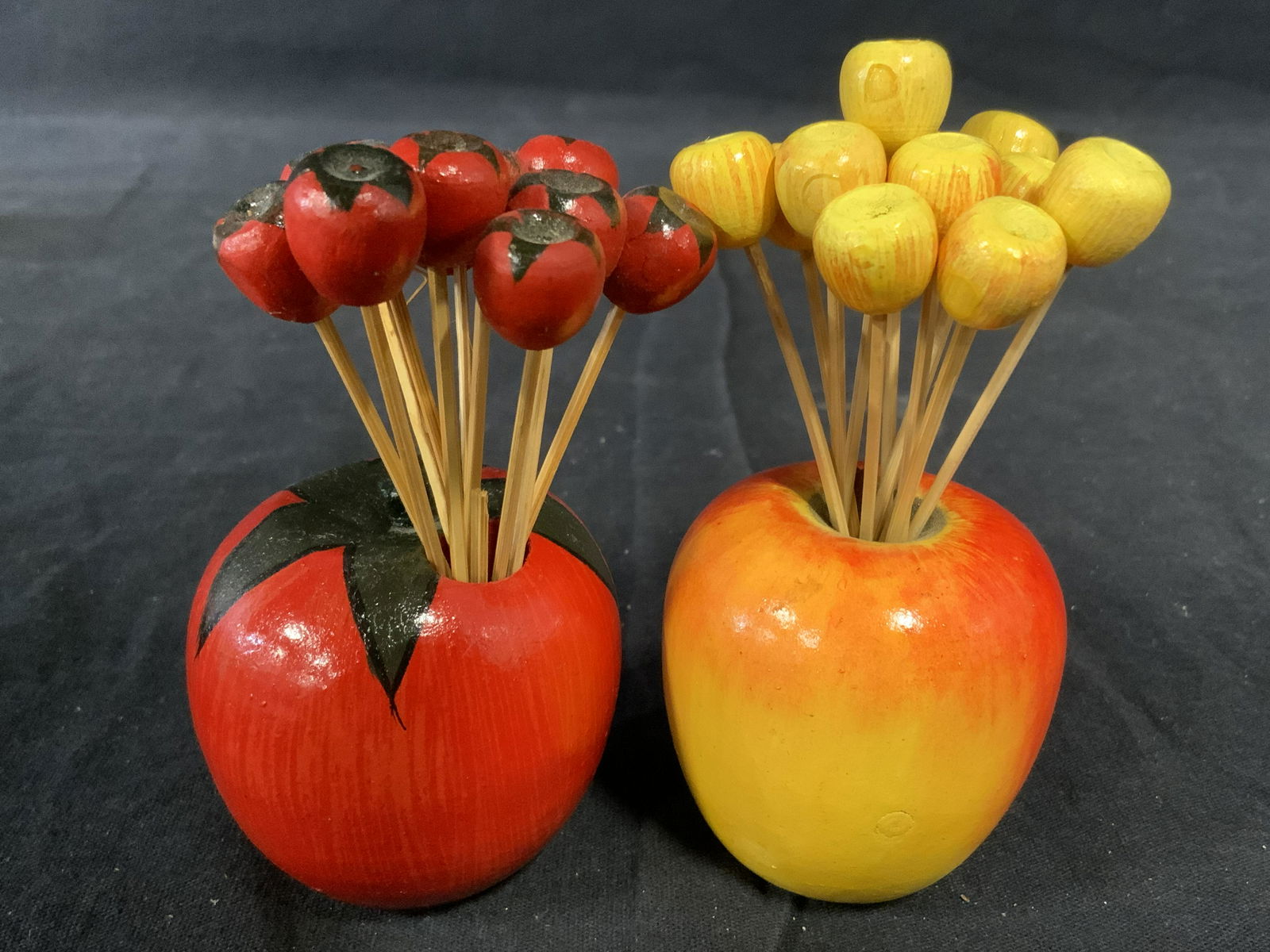 Lot 7 Vintage Dining Room Table Accessories: Lot includes two berry shaped seasoning shakers, 2 seasoning shakers with a ceramic stand, and two apple & tomato shaped skewer/toothpick holders. Property of a multigenerational Brooklyn collectors e