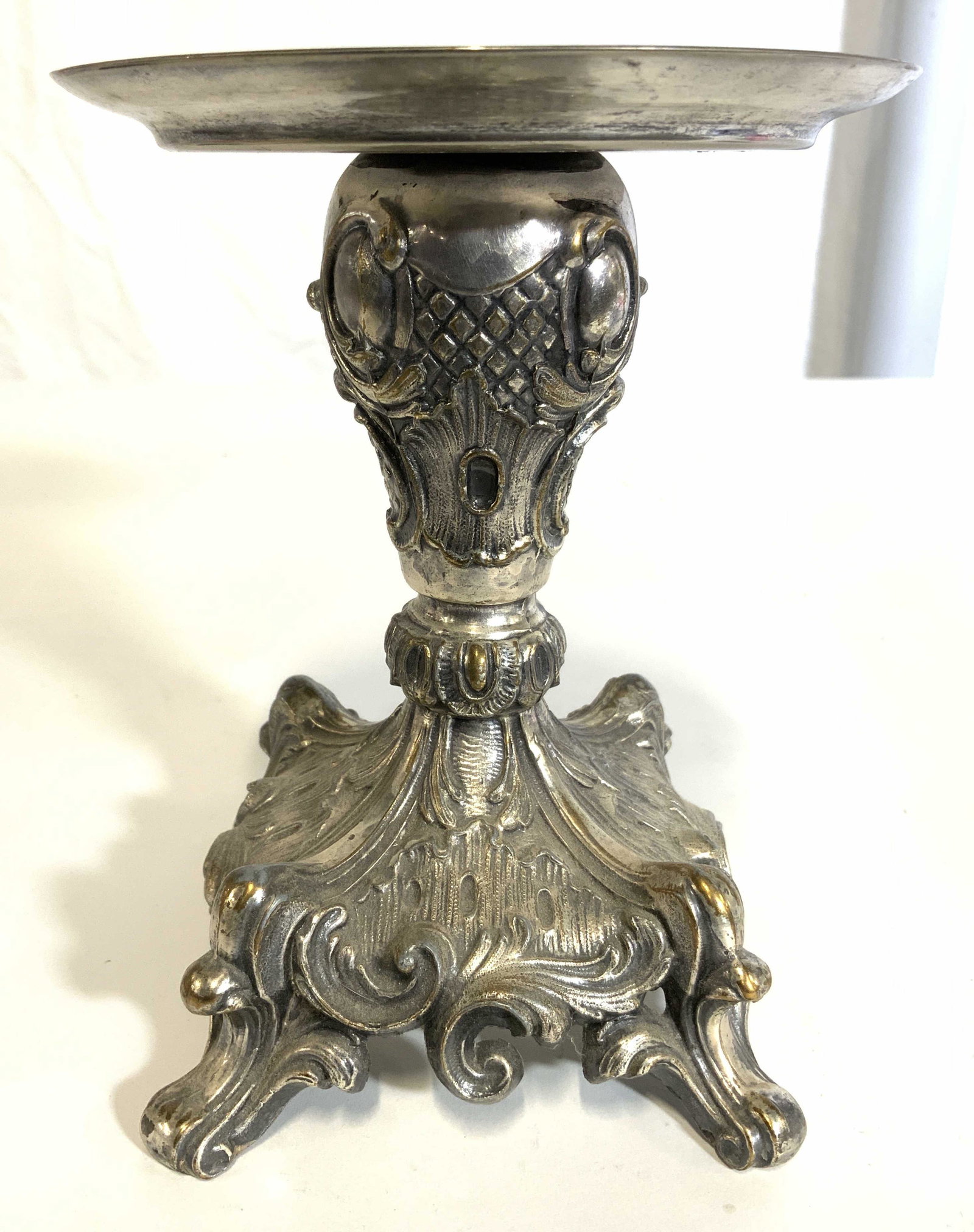 Vintage Ornate Pewter Candlestick Candle Holder: Candlestick is vintage. Piece is silver toned & appears to be pewter. Candlestick has intricate ornate c & s scroll detail. Piece measures approx 6.5 inches tall 4 inches wide & deep. Candlestick, vin