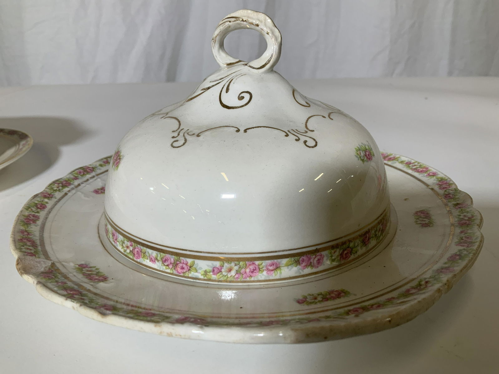 Set 2 POPE GOSSER ROSE China Pieces: Beige China with hand painted roses. Gravy boat with two pouring spouts and shallow bowl with dome lid. Hallmarked Pope GOSSER Plate has chip to rim, dome cover has surface fissure, measures 8.5 in W,