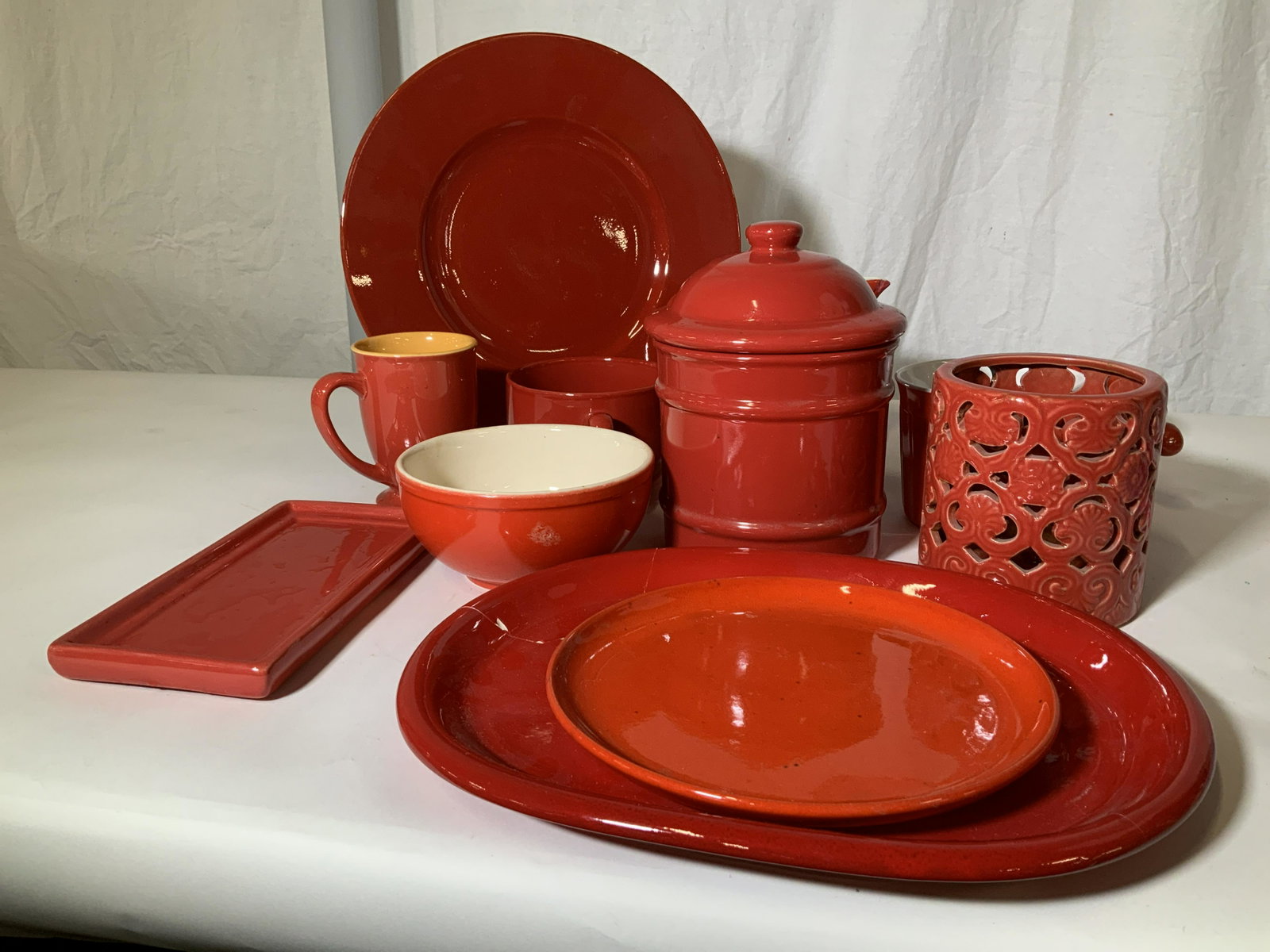 Lot l2 Red Ceramic Kitchenware, Various Makers: Porcelain/ Ceramic / Stoneware kitchen goods from makers ChefElect, Hall’s, Home, Universal Cambridge, Gertz Germany, Crown Corning Japan, Pier 1. Some items micro, dishwasher or oven safe. Includes