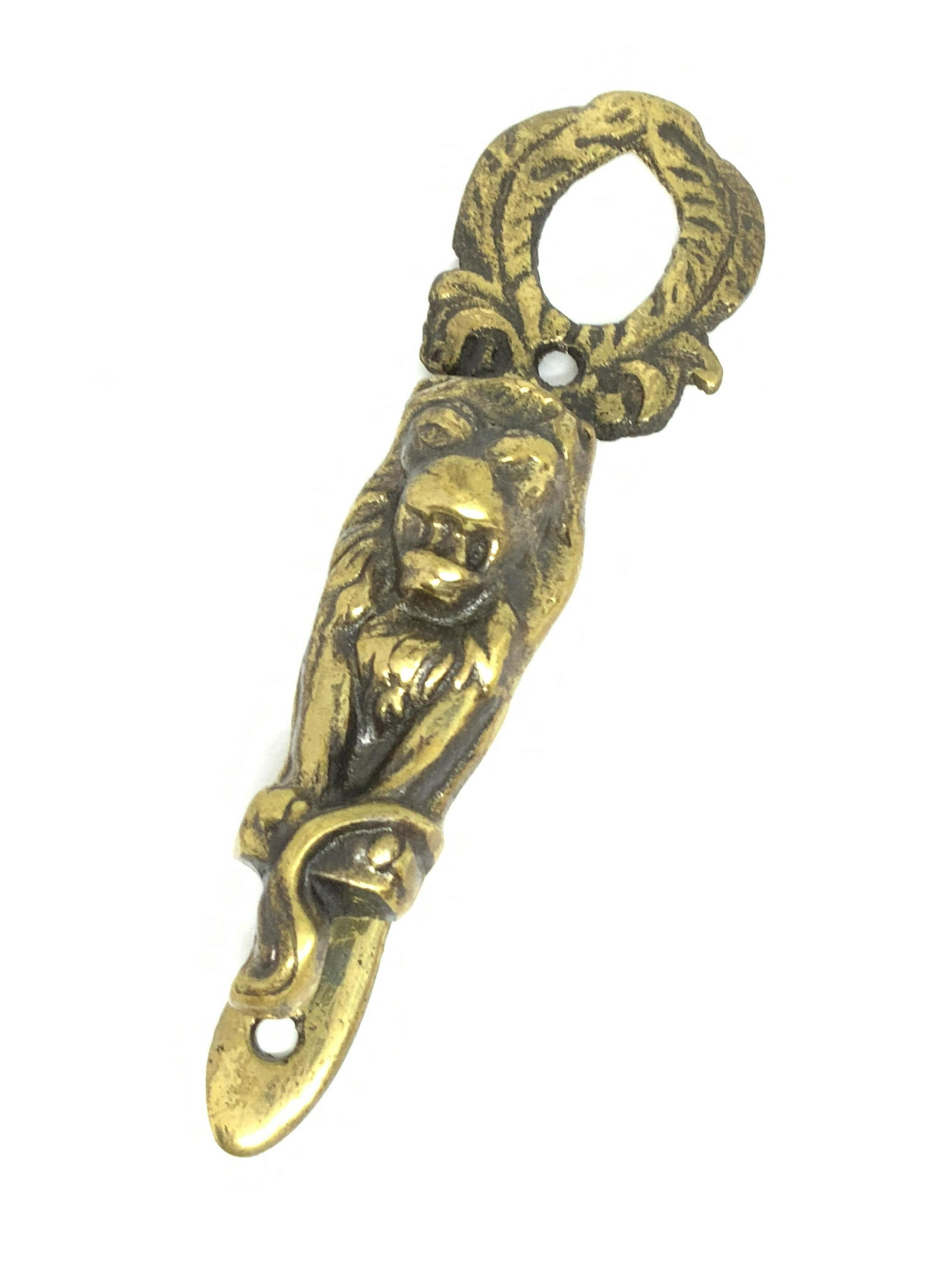 English Gilded Bronze Lion Form Wall Decor: Wall decor crafted from metal, gilded bronze, that has been made to resemble a lion. The lion is depicted seated with it’s mouth open. The piece features pierced and embossed metalwork. Piece operat