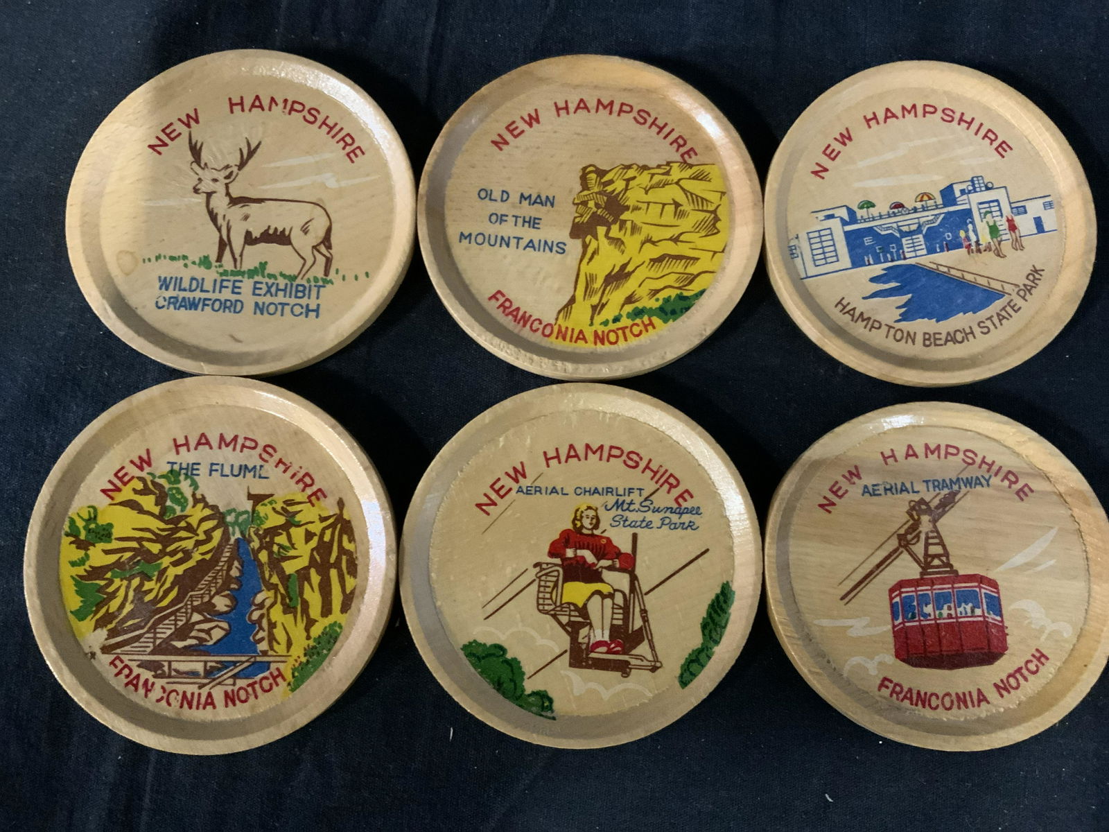 Lot 49 Vintage Coasters, Kitchenalia: Lot 49 vintage coasters, crafted from ceramic, wood, and plastic. Various designs and manufacturers. Largest measures approx 3.5 inches in diameter. Wear is consistent with age and use. Property of Mu