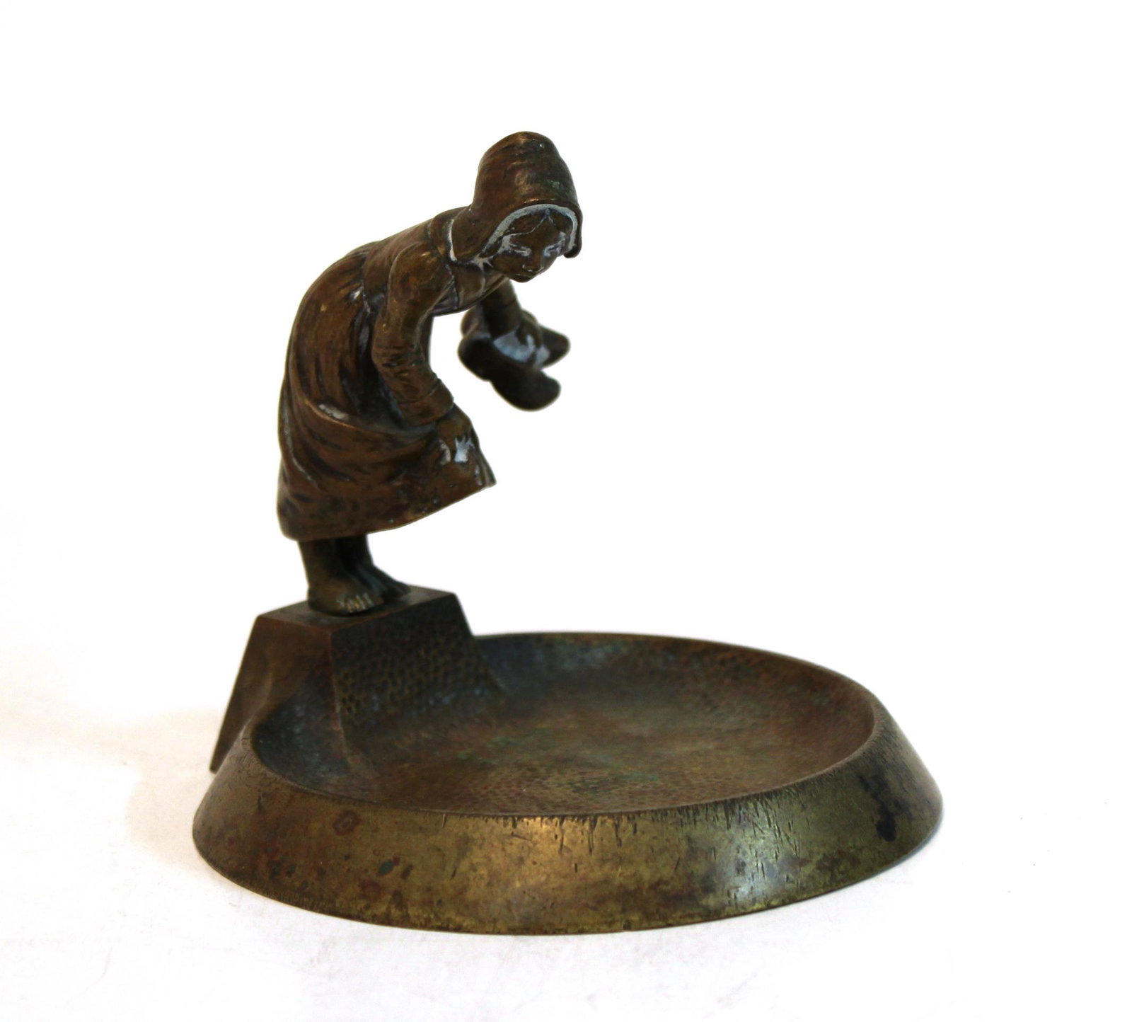 Bronze Dutch Girl Vide Poche / Coin Holder: Bronze Dutch Girl Vide Poche / Coin Holder Continental, possibly Austrian, bronze vide poche or coin holder cast with the figure of a Dutch girl holding her skirt and a pair of wooden shoes. 4.5" H X 