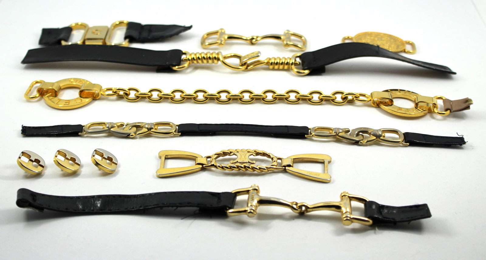 Celine & Ferragamo Purse Accessories: Celine & Ferragamo Purse Accessories Celine and Ferragamo purse accessories / hardware and buttons, including seven pieces of gold-tone purse strap links, stamped "Celine," and three two-tone buttons