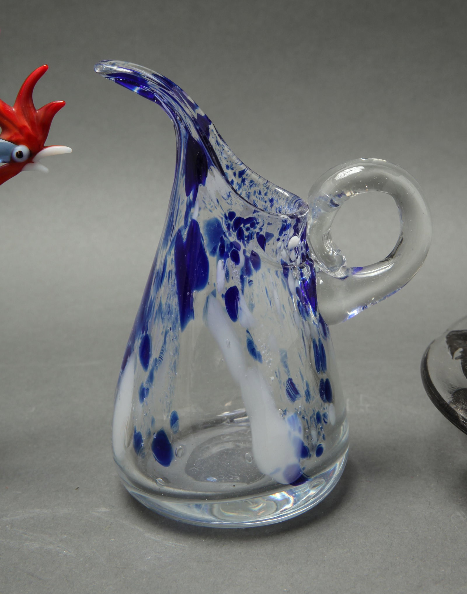 Group Of Vintage Glassware, 6: Group Of Vintage Glassware, 6 Group of vintage glass, comprising green and colorless glass candlesticks marked "VNAson&C", blown glass figurines of a rooster and flowers in a vase, a blue and clear gl