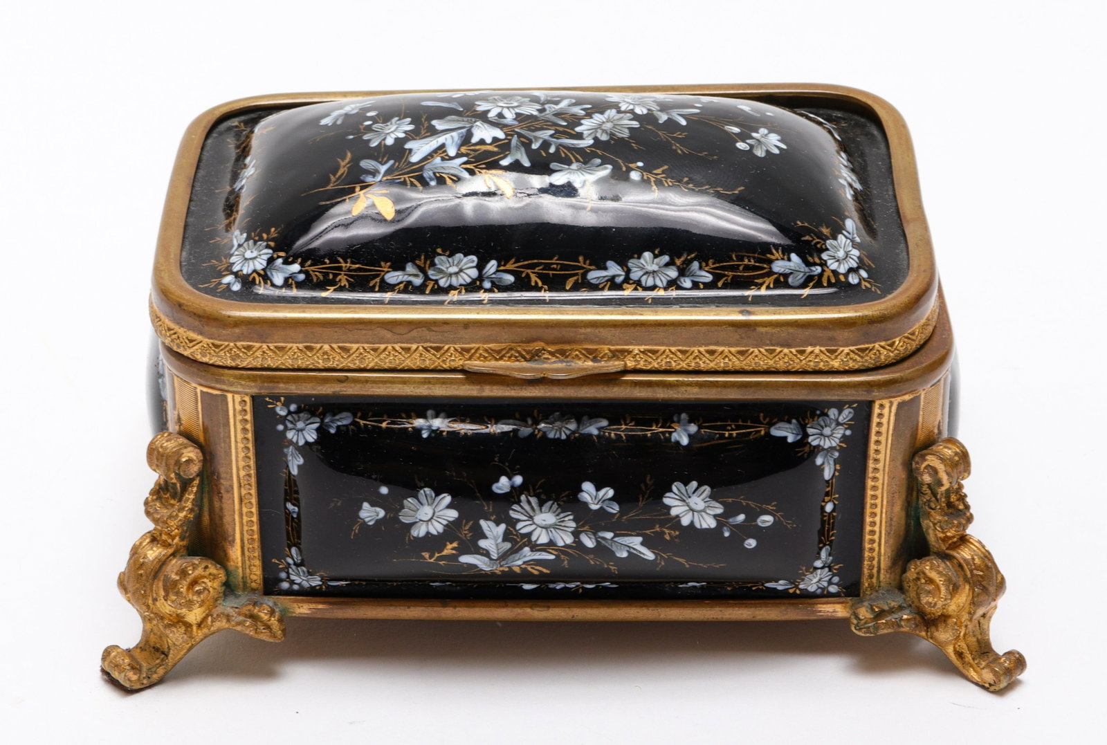 Continental Enamel & Brass Dresser Box: Continental Enamel & Brass Dresser Box Continental brass and enamel dresser / trinket / jewelry box with hinged lid, hand-painted with floral motif decoration. 2.5" H x 5.375" W x 3" D.