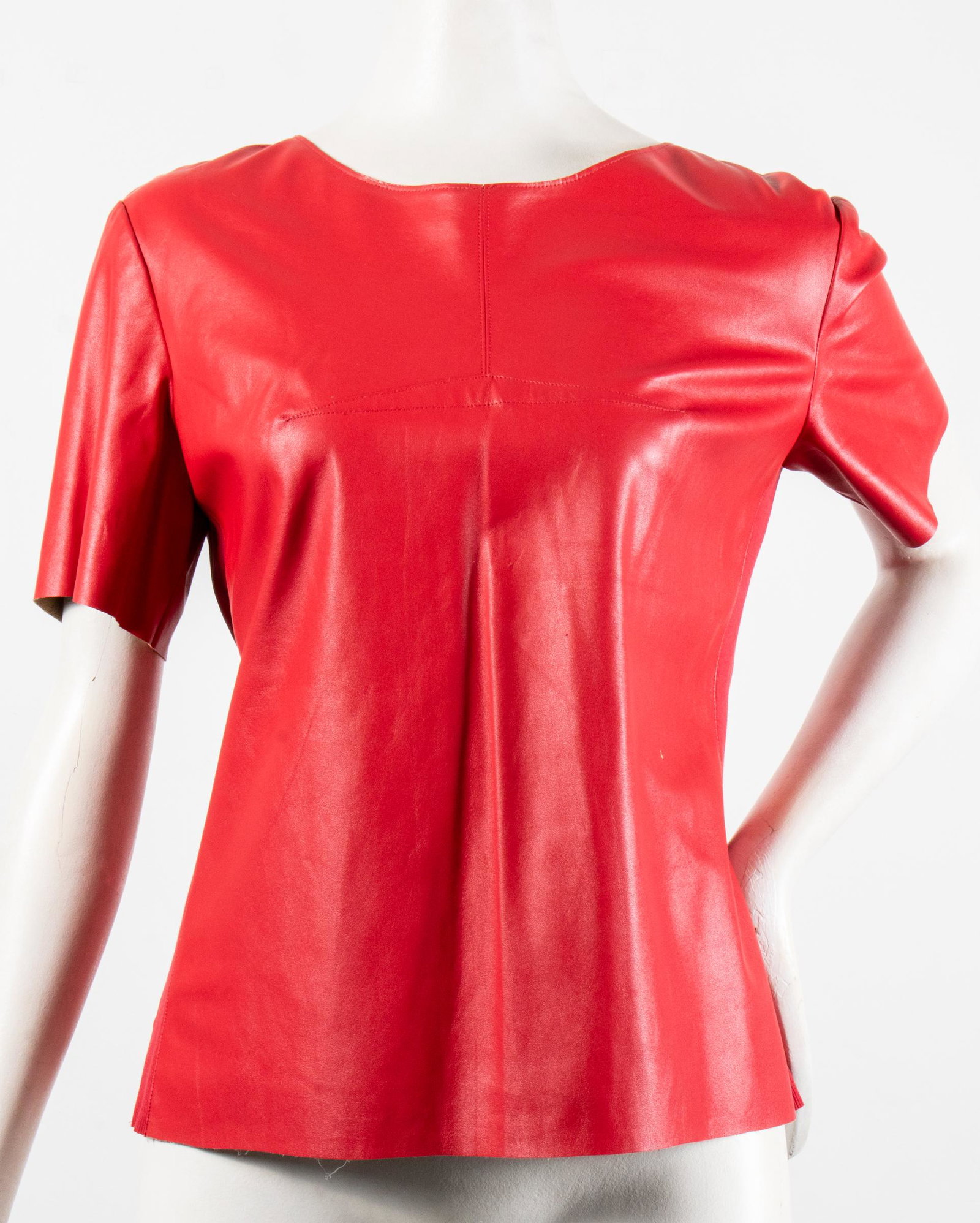 BCBG Max Azria Faux Leather Top: BCBG Max Azria Faux Leather Top BCBG Max Azria faux leather top, t-shirt form with short sleeves, darts to chest and along back waist, fully zippered back, fabric panels to sides, designer's label and