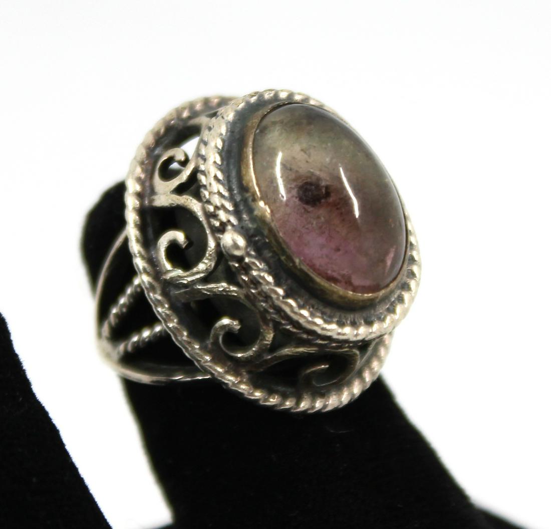 Taxco Silver and Amethyst Locket Ring: Taxco Silver and Amethyst Locket Ring Ornate Taxco tribal locket or pill ring in silver with oval central amethyst. Marked: "Mexico / 925 / TAXCO" with makers mark. Ring has adjustable shank Measures 