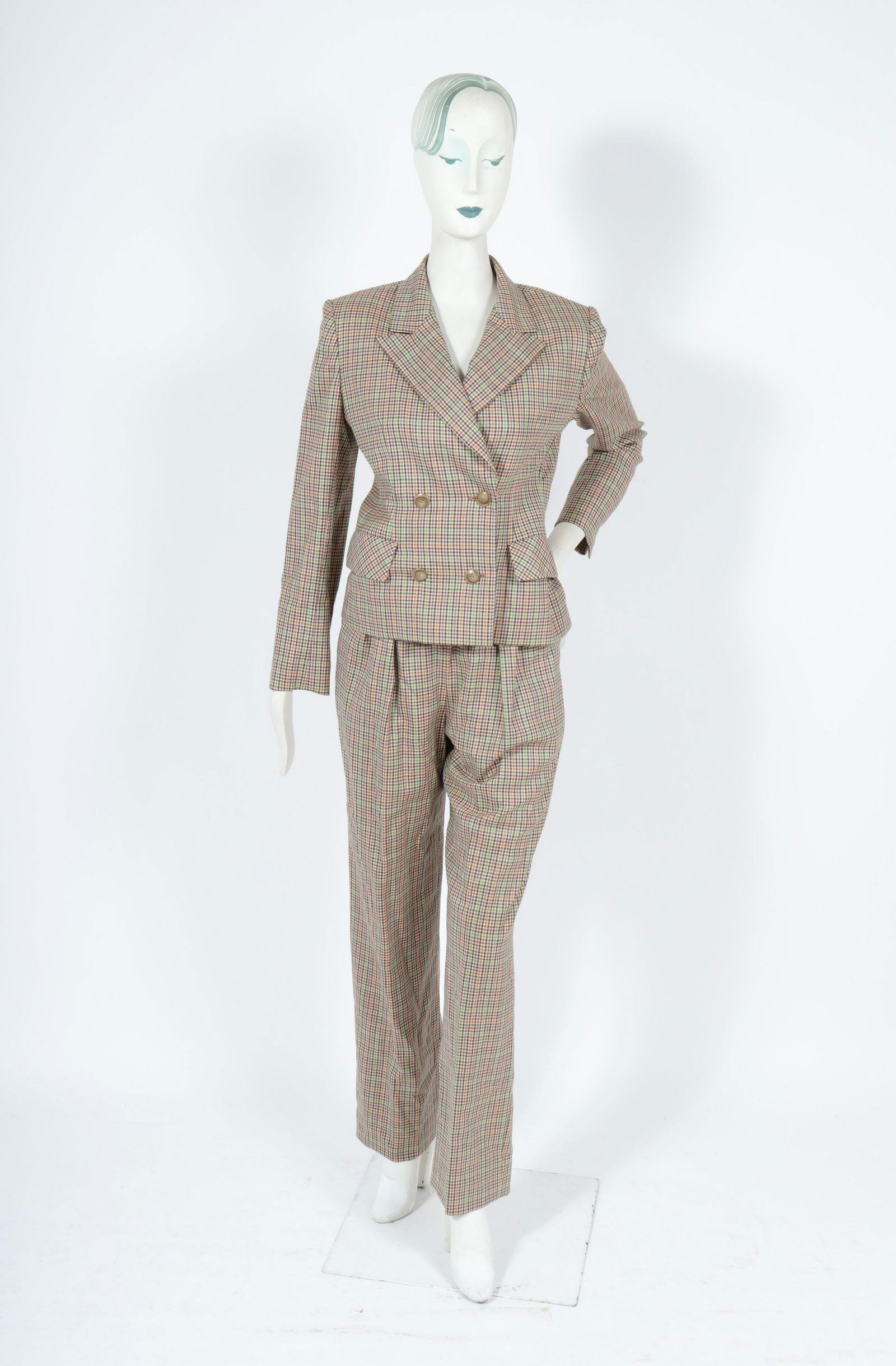 Bill Blass Tailored Wool Pant Suit Set: Bill Blass Tailored Wool Pant Suit Set Bill Blass plaid wool blazer with matching pants, the blazer double-breasted with two side pockets, designer's label "Bill Blass" to interior. Shoulders: 16" W;