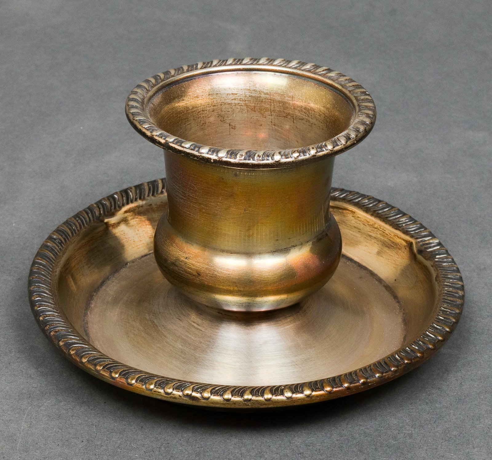 Cartier Sterling Silver Candlestick: Cartier Sterling Silver Candlestick Cartier sterling silver candlestick with gadrooned edge, marked underside: "Cartier M Sterling 507." 2.75" H x 4.5" diameter. Approx: 2.59 ozt. Minor dents around d