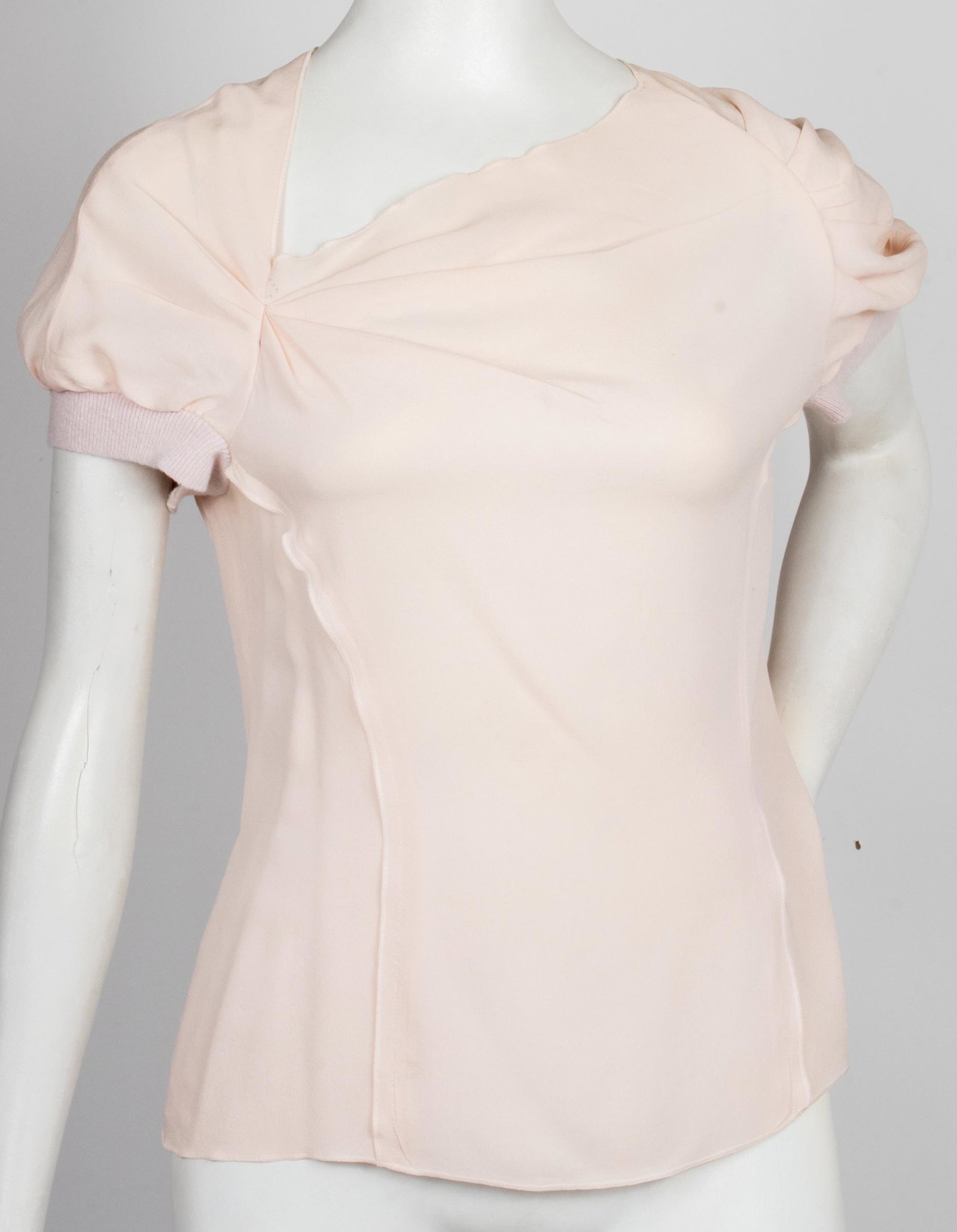 Nina Ricci Designer Silk Short Sleeve Top: Nina Ricci Designer Silk Short Sleeve Top Nina Ricci designer silk crepe short sleeve top, with asymmetric neckline with pleated cinching, short sleeves with fabric elastic cuffs, darts to torso, zipp