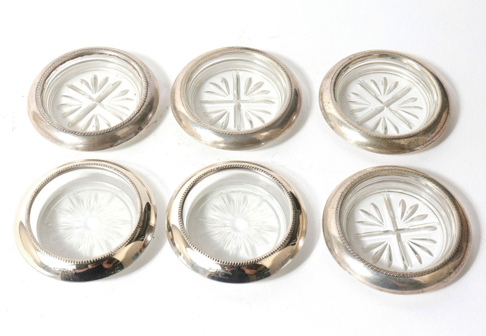 Silver & Glass Coasters, Set of 6: Silver & Glass Coasters, Set of 6 Assembled set of six silver and glass coasters, three marked: "Sterling," the other three tested silver. All approx: 4" diameter. Silver not weighable.