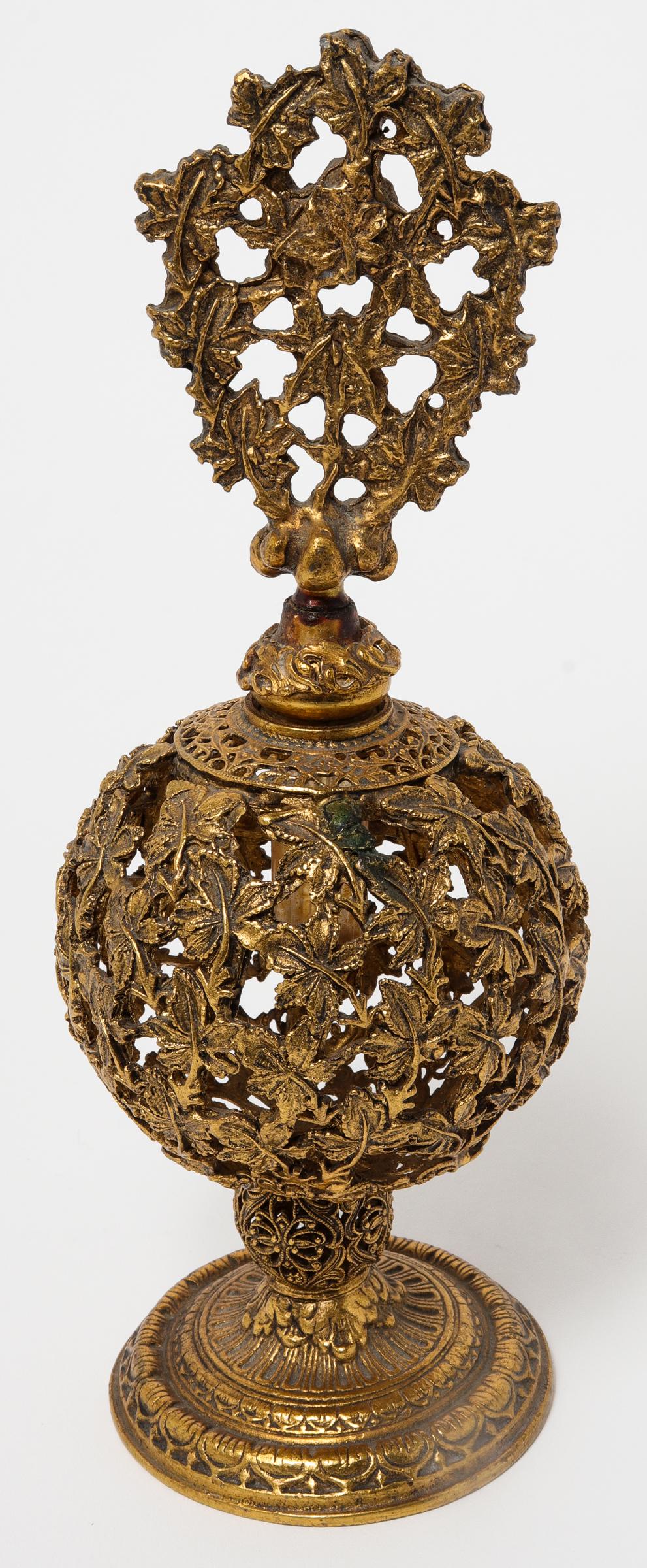 Renaissance Revival Gilt Metal Perfume Bottle: Renaissance Revival Gilt Metal Perfume Bottle Renaissance Revival gilt metal perfume bottle, 20th century, throughout with foliate motif. 8.75" H x 3.25" diameter.