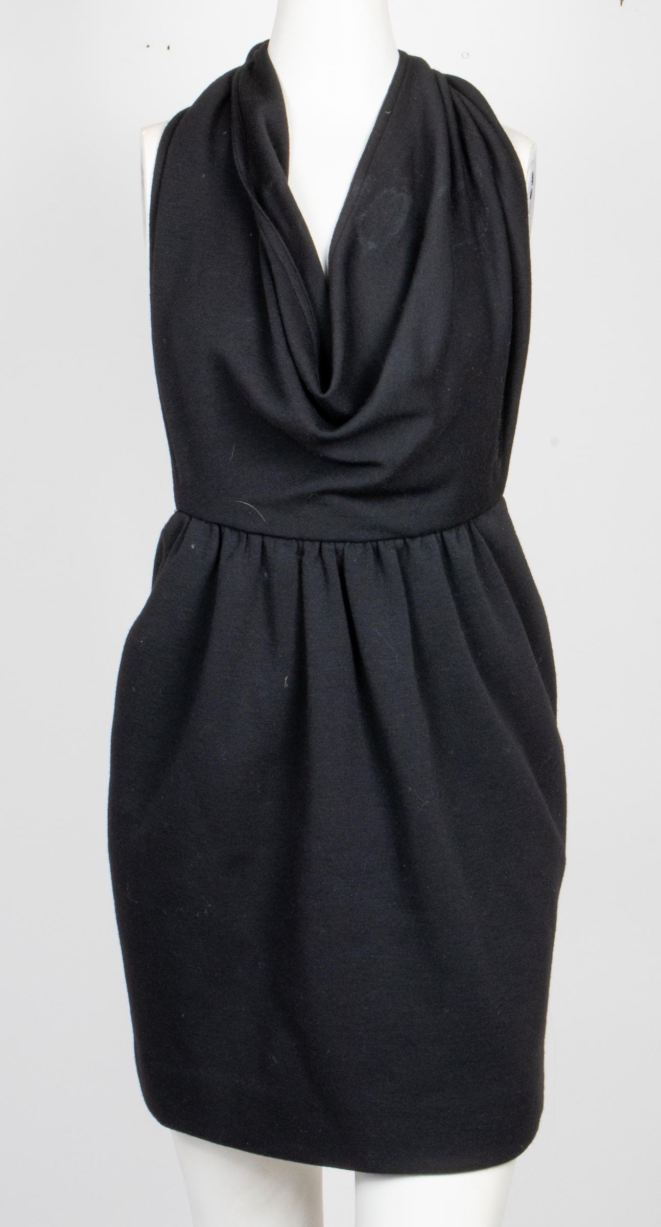 Bill Blass Tie-Back Tube / Halter Dress: Bill Blass Tie-Back Tube / Halter Dress Bill Blass tie-back tube or halter dress with large strap panels, side pockets, zippered side, and designer's label "Bill Blass" to interior. Waist: 13" W; hips