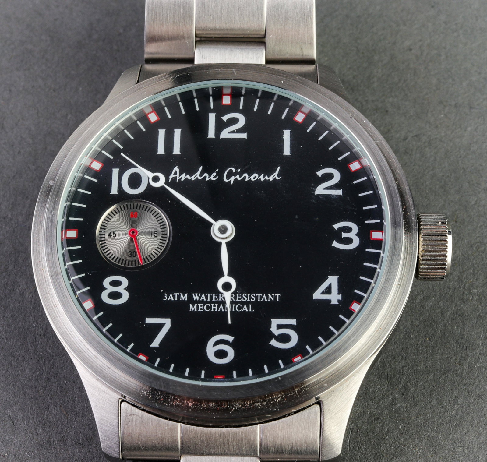 Andre Giroud Stainless Steel Mechanical Watch: Andre Giroud Stainless Steel Mechanical Watch Andre Giroud stainless steel mechanical wristwatch with silver-tone bezel, signed on dial, with stainless steel bracelet. Case: 44 mm.