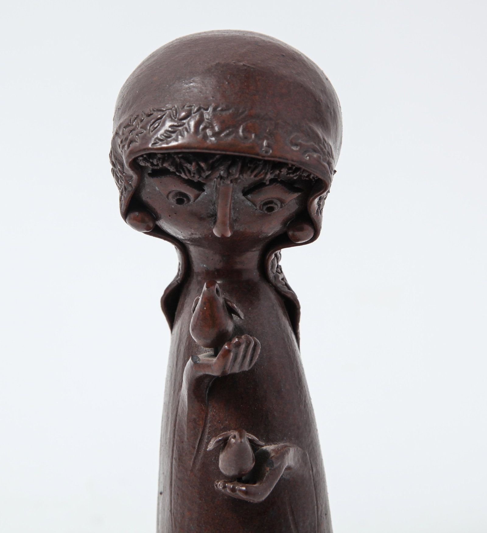 Shlomo-Dube Israeli Ceramic Figurine: Shlomo-Dube Israeli Ceramic Figurine Shlomo-Dube Israeli ceramic figure of a cloaked figure holding two doves, marked to reverse. 7.5" H.