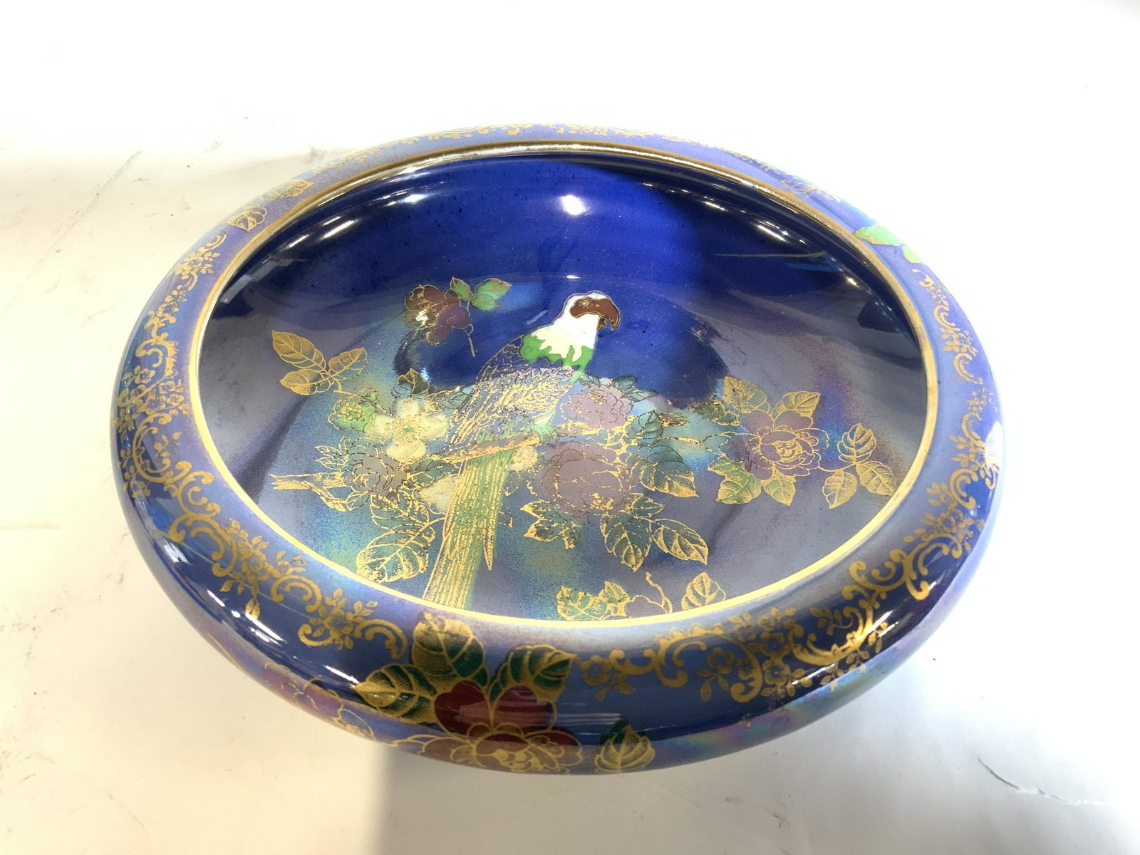 CROWN DEVON LUSTRINE FIELDINGS Porcelain Vessel: Underside of piece is marked CROWN DEVON LUSTRINE FIELDINGS STROKE ON TRENT ENGLAND ROYAL KEW. Vessel has luster ware appearance. Bowl has blue with intricate multi toned floral, leaf, and bird detail