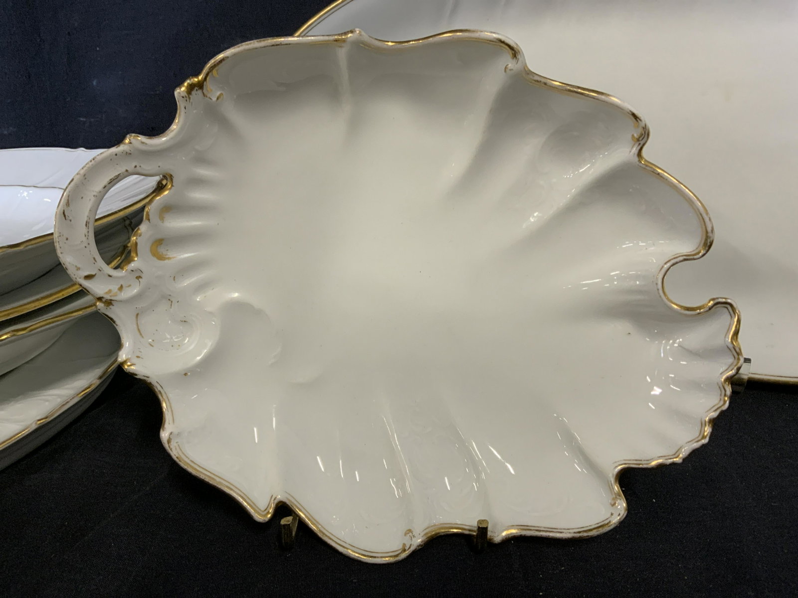 Group Lot H&C SCHLAGGENWALD Serving Platters: Lot 12 Vintage Ceramic serving platters. Edges as well as some wells are colored with gilt paint. Undersides of plates bear the trademark or H&C SCHLAGGENWALD, some dated, some marked Czech Slov. Larg