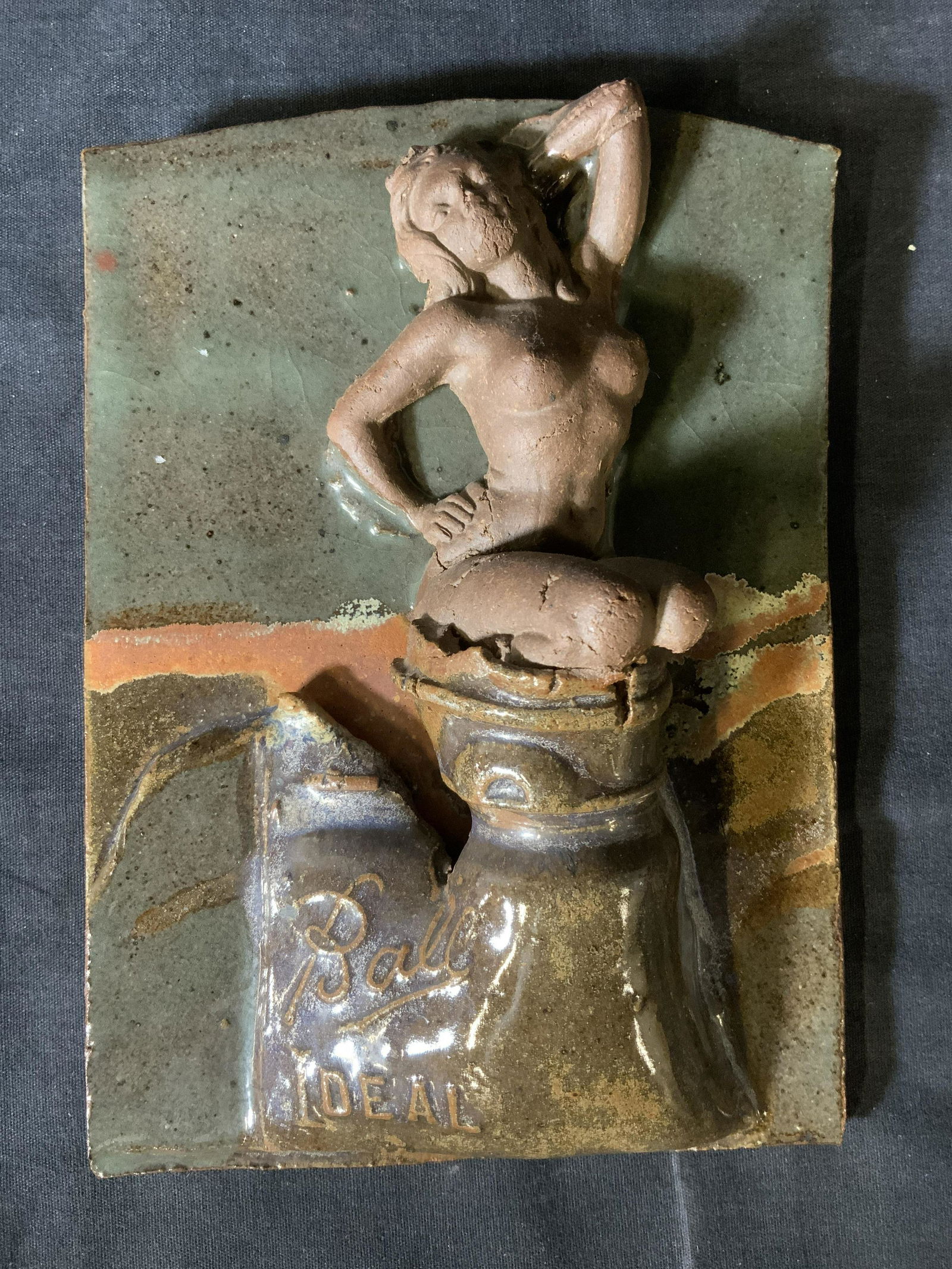 BALL IDEAL Ceramic Relief Panel Artwork: BALL IDEAL Ceramic Relief Panel, inscription reads ‘Ball Ideal’, subject a woman on a pedestal, measures 8 1/8 x 6 inches, some surface wear and loss to leg, Ball ideals, ceramics, artwork, sculpt