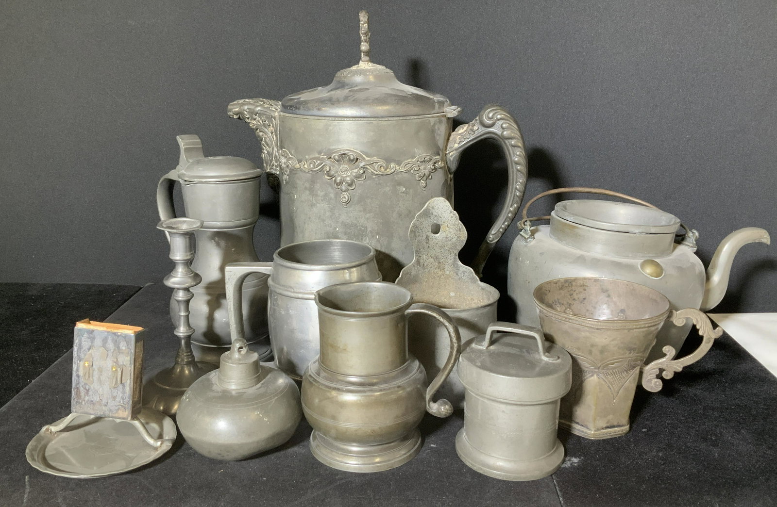 Group 11 Vintage Pewter & Metalware Accessories: Grouping of vintage, possibly some antique pewter and other white metal tableware. Some pieces marked - candlestick John Somers, Matchbox holder TENN 58, ink well, beer/ ale mug, pitchers, creamer, ve