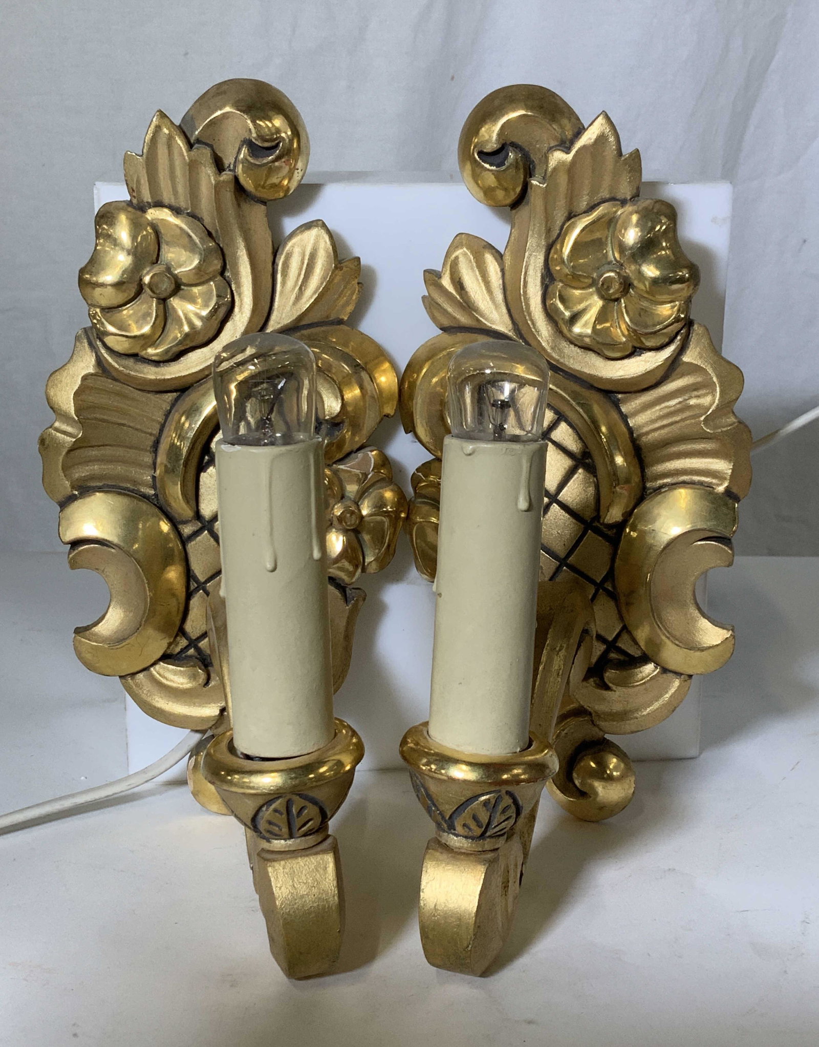 Pair Art Nouveau Gilt Wood Sconces: Vintage Pair Of Gilt wood Sconces with Art Nouveau Flair, witched wood with carved out flower and scrolls, measures 9.25 in ht, 4.5 in w. Lightweight. Sm chip to one petal on flower, Art Nouveau Gilt 