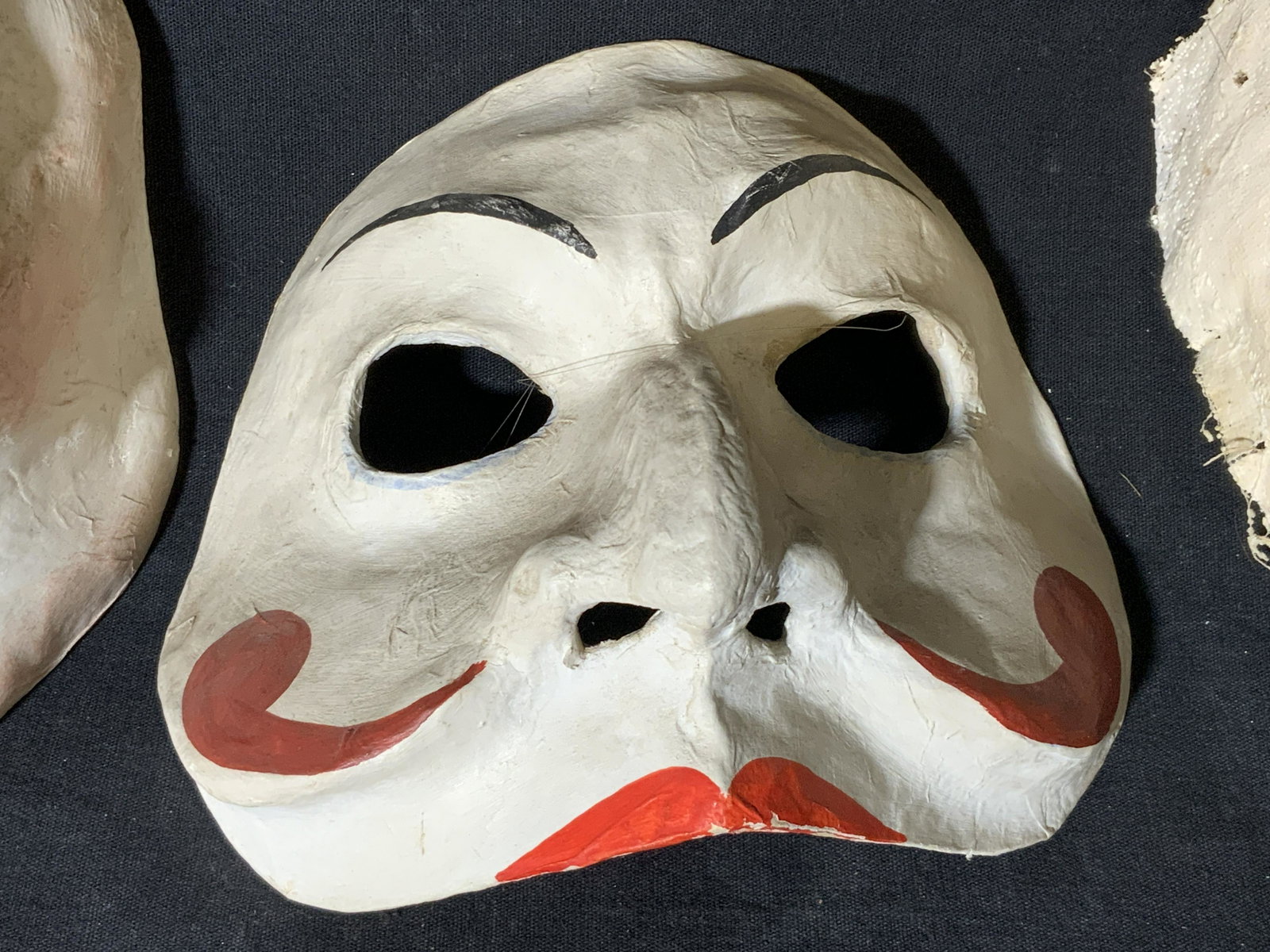Group 3 Papier-Mache Masks: Group 3 papier-mache masks, labels to reverse of two read ‘Laboratorio Artiguano Maschere’, one of three unfinished, two of three hand painted and sculpted, largest of the three measures approxima