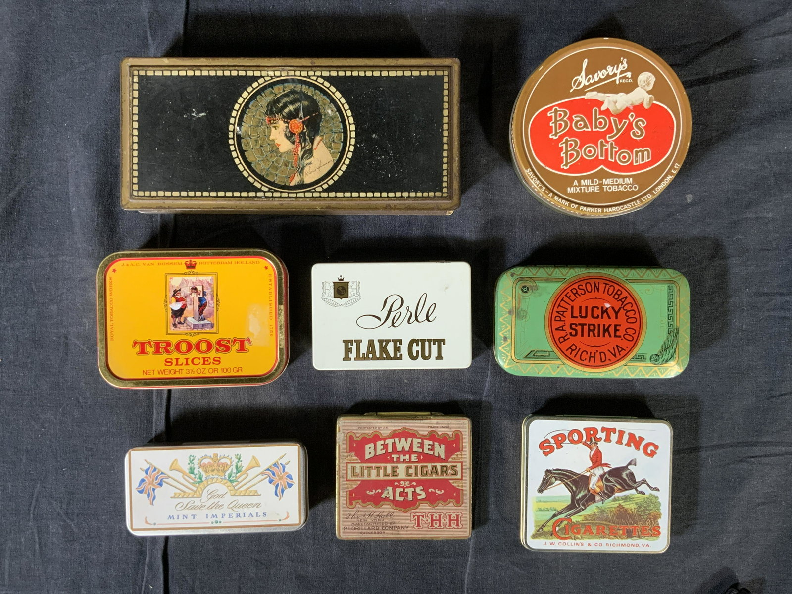 Lot 8 Vintage Containers & Cigarette Tins: Lot 8 Vintage Containers & Cigarette Tins, inscriptions read ‘Beautebox Canco’, ‘J & AC Van Rosen Troost Slices’, ‘Perle Flake Cut’, ‘God Save the Queen Mint Imperials’, ‘Sporting Ci