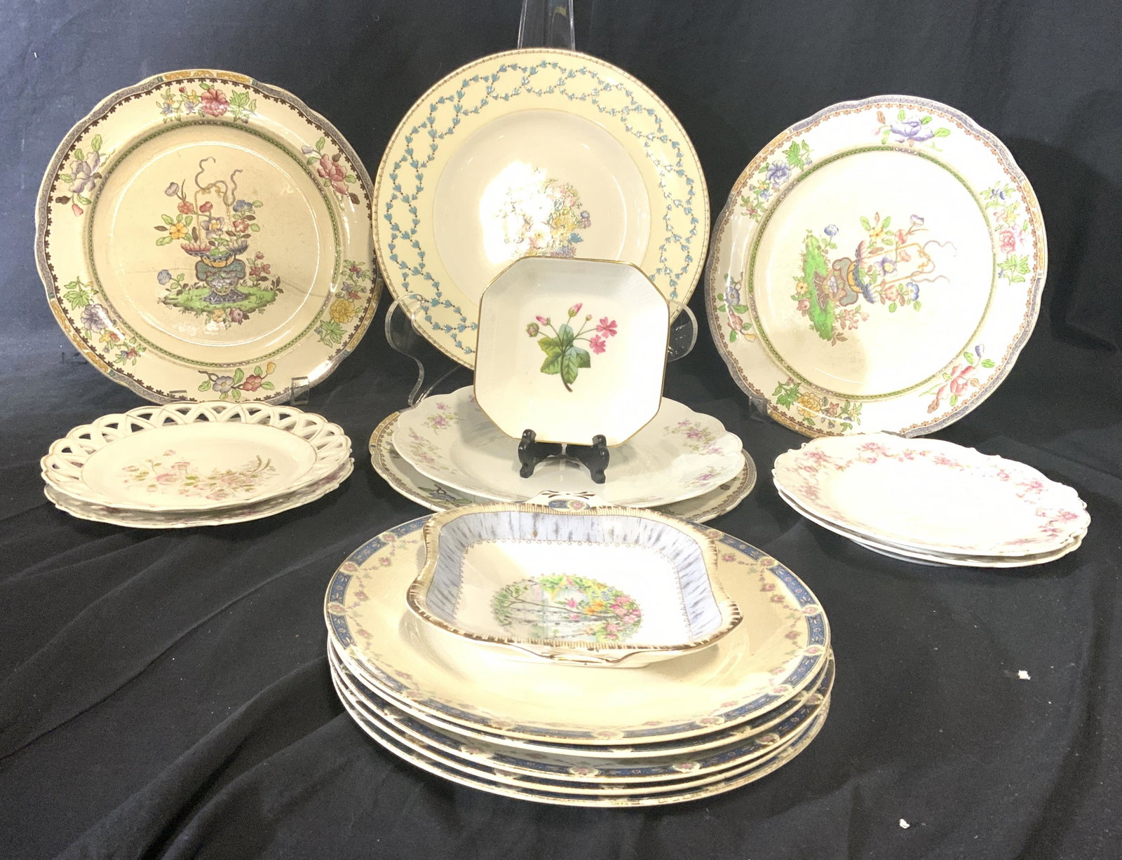 Lot 16 Vintage Assorted Porcelain Dishes: Lot includes 16 porcelain dishes. Some trademarks including MINTON, ROYAL ALBERT, NATIONAL CHINA COMPANY & More. Some dishes are matching. Lot has various decorative patterns. Largest plate measures a