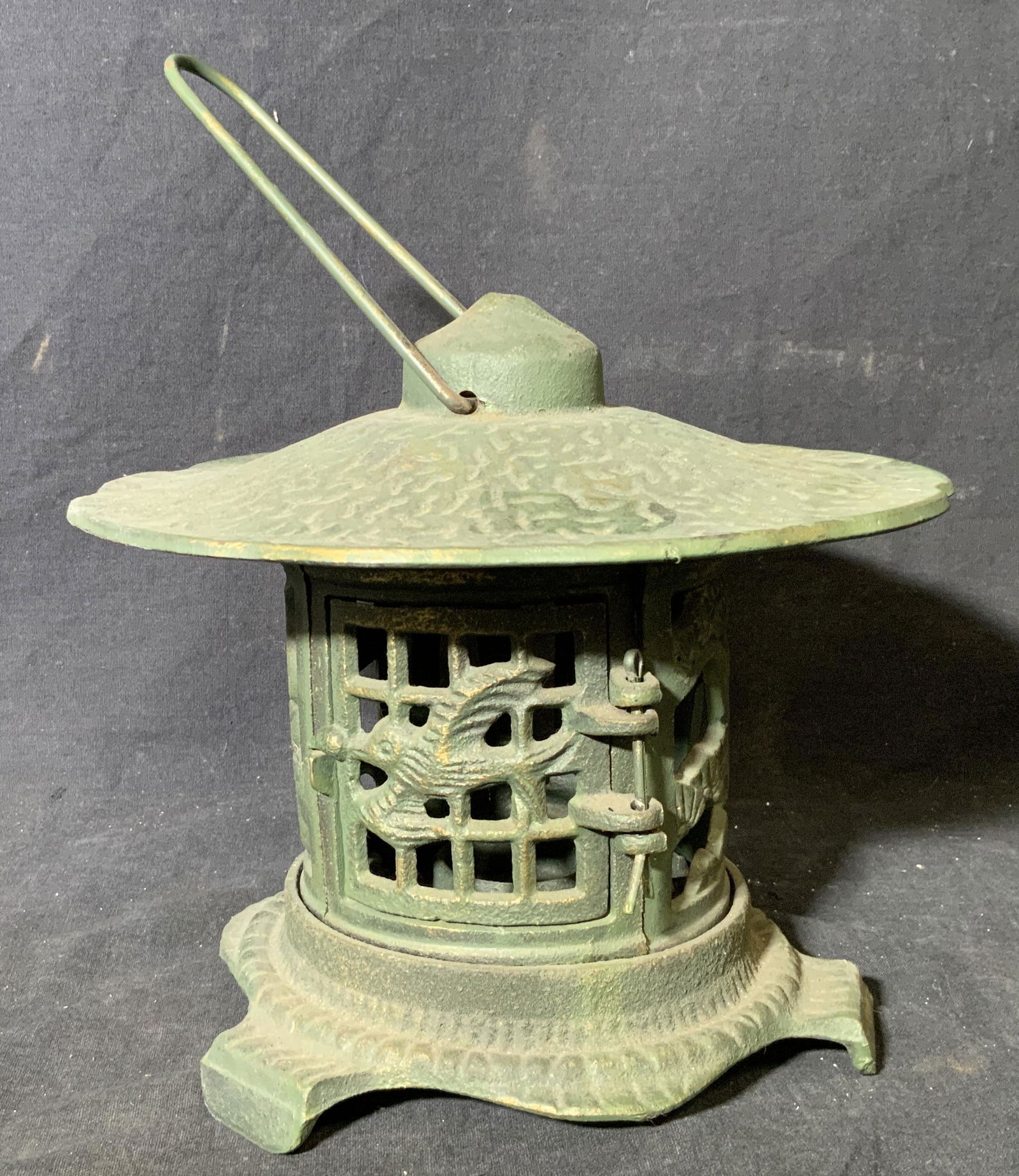 Iron Tea Light Candle Lantern: Iron tea light candle lantern, no apparent inscriptions or markings, subject an iron lantern with a bird design to the door, interior has place holder for a singular tea light candle, piece measures 1