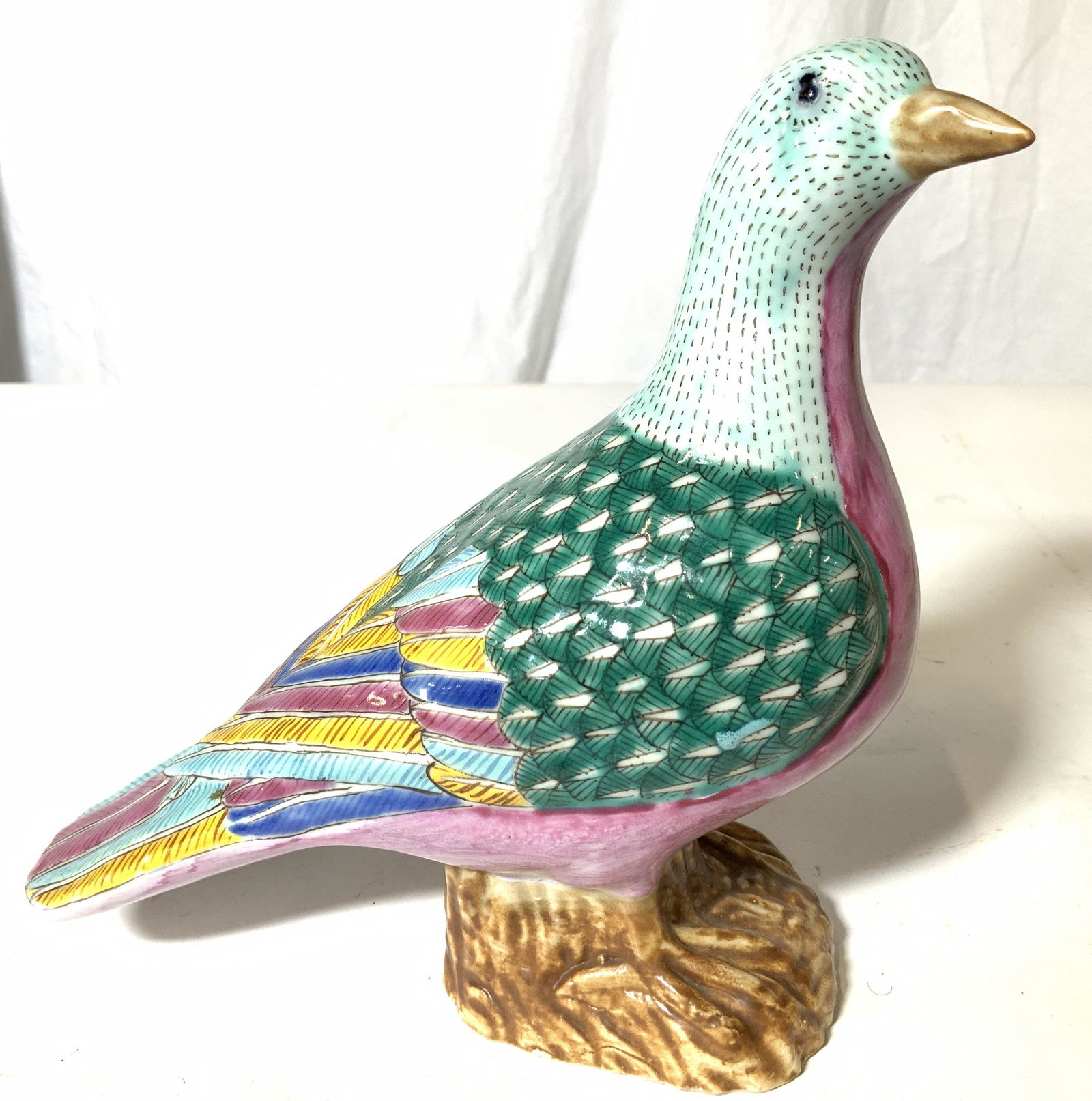 Chinese Hand Painted Pigeon Statue, Hallmarked: Colorful hand painted pigeon with detailed feather marking, bright aqua, yellow, green, pink and blue patina. Underside impressed ‘China’’ . Made of ceramic. 9 in L, 3.5 in. W, 7 in. Ht. Asian h