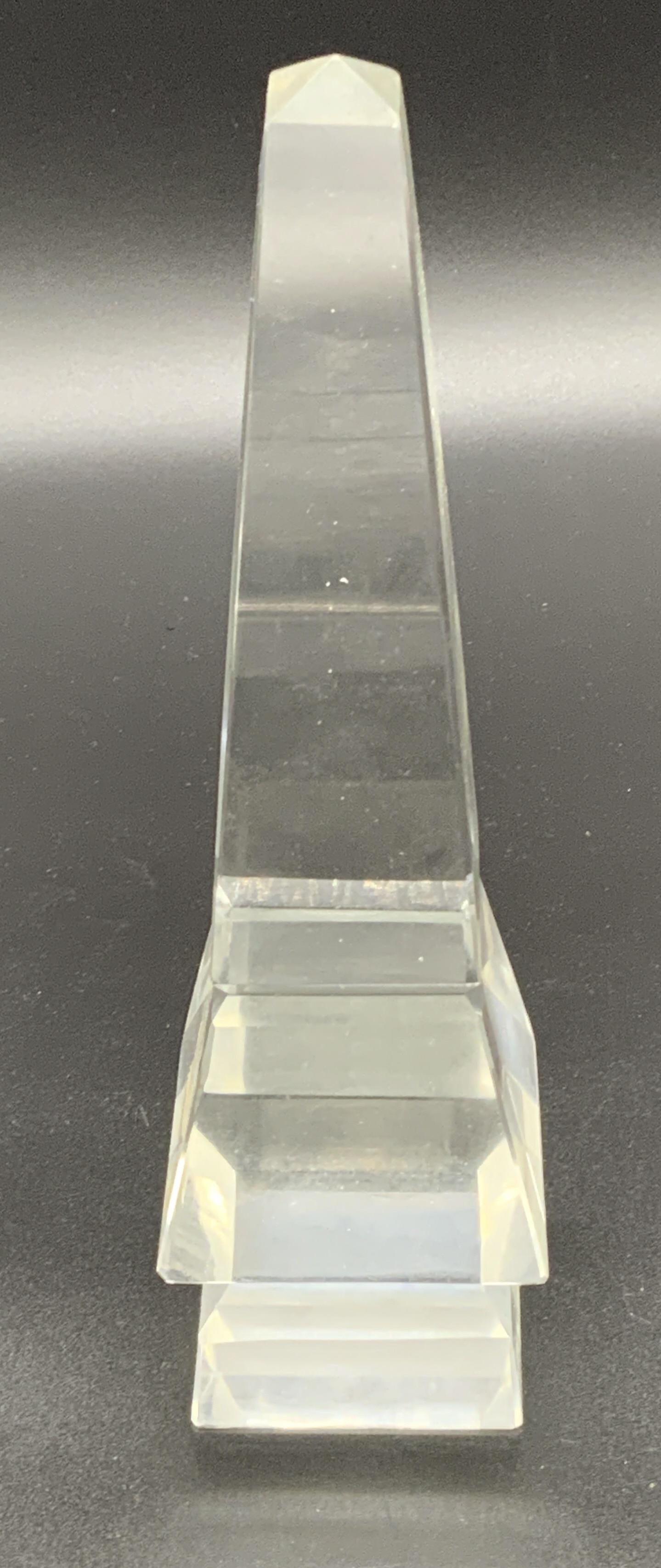 Cut Glass Obelisk Ornament: Cut glass obelisk, no apparent inscriptions or markings, subject a platformed obelisk made of clear cut glass, piece measures 8.5 inches at tallest point, some scuffs to surface, Cut glass, glass, art