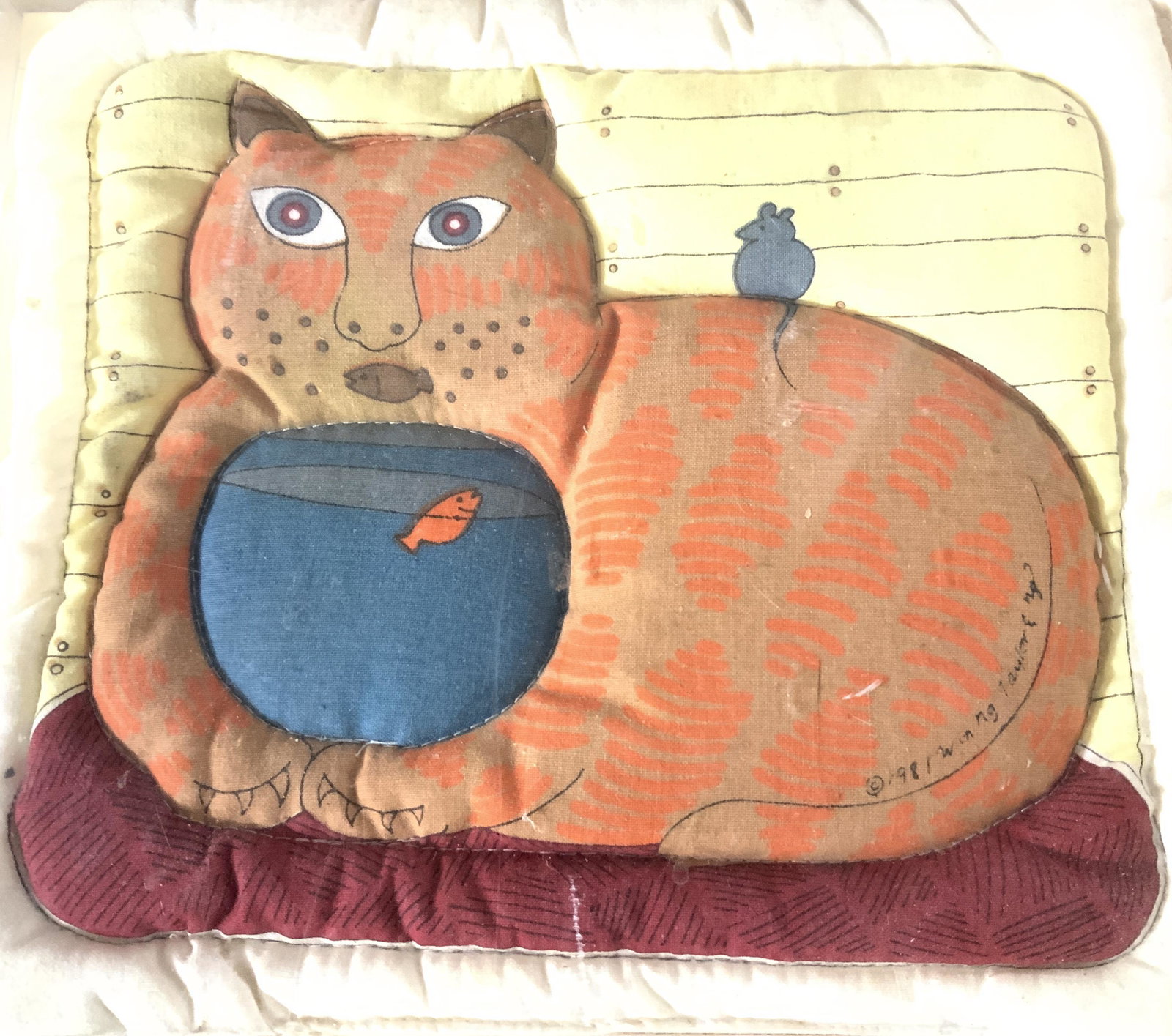 Hand Sewn Quilted Folk Art Cat Oven Mitt,Framed: Made in Hong Kong, this is a vintage Oven mitt that is a framed in an acrylic clear frame. Original designer label attached. Cat is holding fish bowl with gold fish in it, has a fish mouth, and mouse 