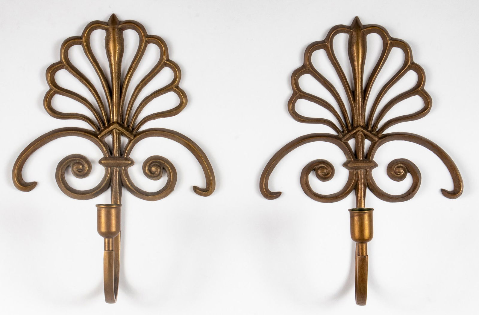 Patinated Brass Candle Wall Sconces, Pair: Pair of patinated brass candle holder wall sconces with pierced fan motif. 12" H x 8.5" W x 4" D.