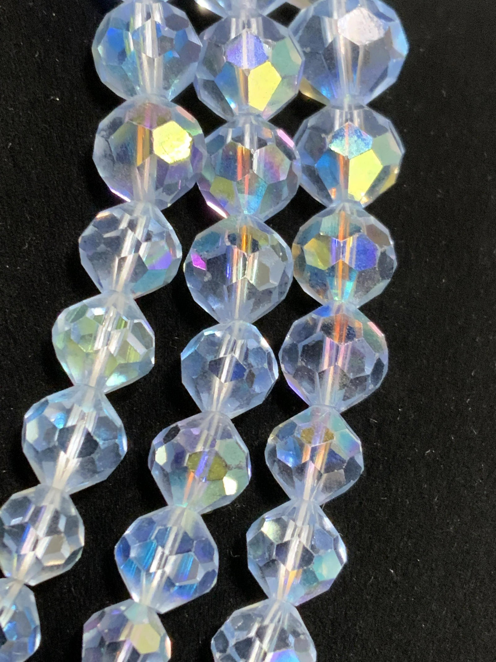 Set2 LAGUNA Vntg AURORA BOREALIS Crystal Necklaces: Two vintage necklaces, one a multi strand crystal necklace and the other a crystal choker. The light blue Aurora Borealis crystals are all faceted and circular in shape. Both necklaces are graduated, 