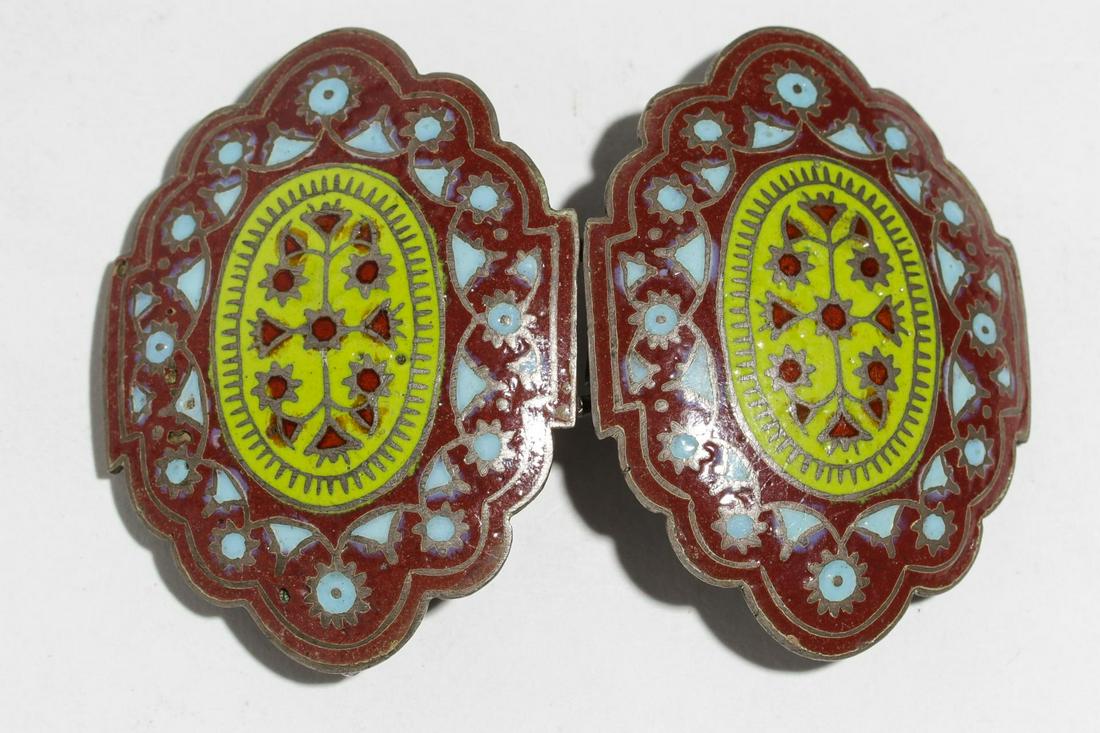 Silver & Champleve Enamel Belt Buckle: Silver belt buckle, the two halves with champleve enamel in brick red, light blue, and light green. Joined halves: 3" L together. Silver tested; approx. 1.2 ozt. total (including enamel).
