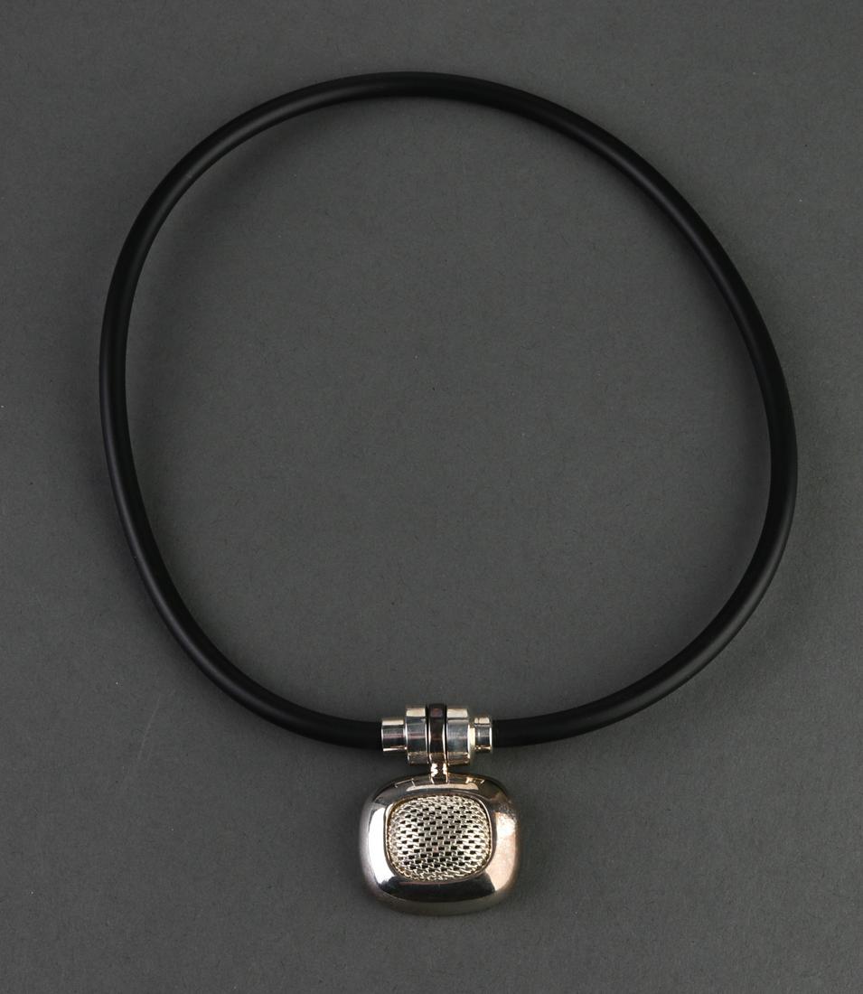 Espo Sterling Silver Pendant Necklace: Espo sterling silver pendant necklace with rubber cord, removable rectangular pendant with mesh center, signed: "925 Mesh Sig." Pendant: 1.5" H x 1.125" W. Pendant approx: 0.51 ozt.
