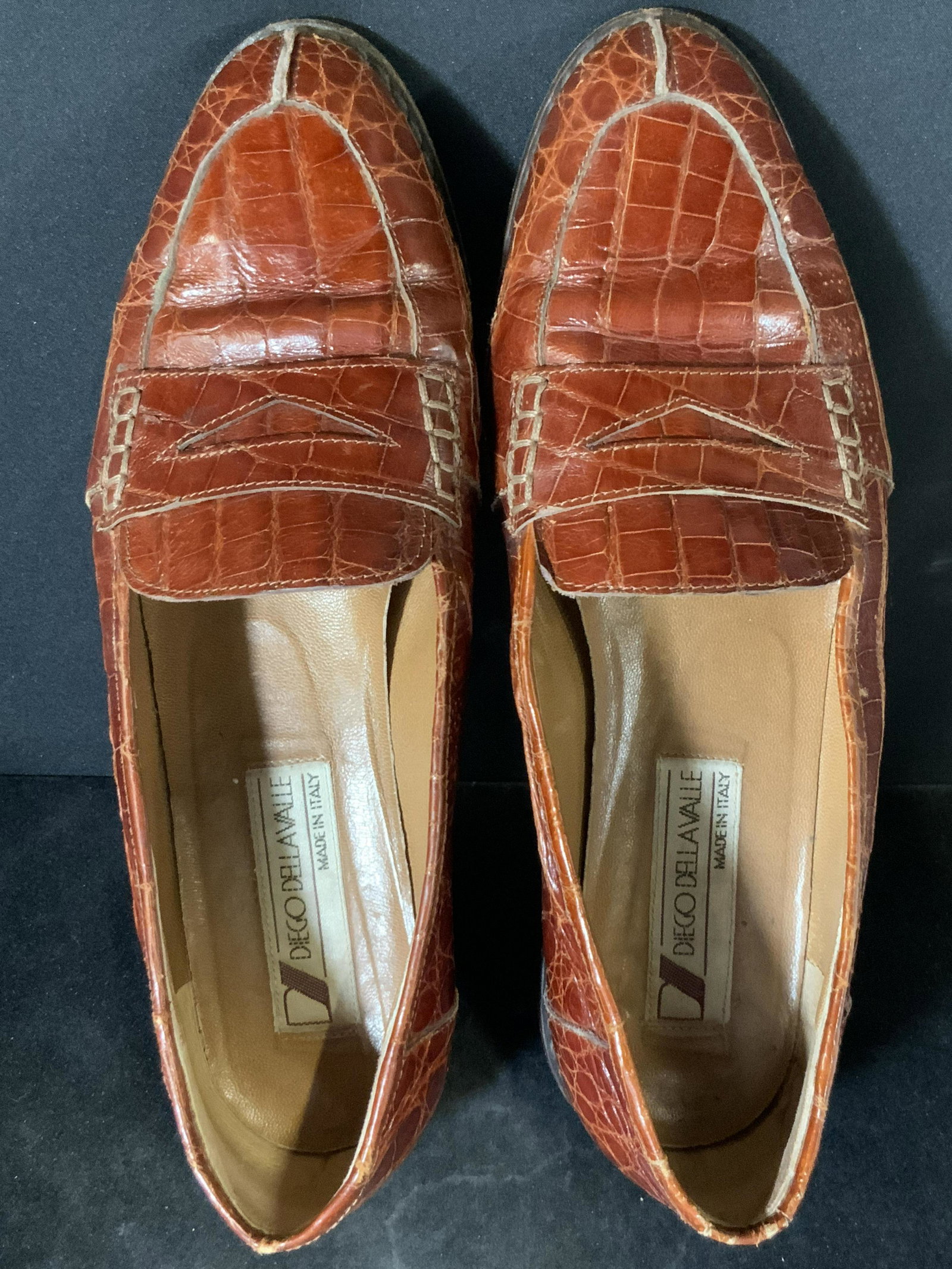 DIEGO DELLA VALLE Italian Crocodile Style Shoes: Possibly vintage Diego Della Valle brown crocodile style Ladies shoes. Underside reads: Diego Della Valle, Made in Italy, 37. Size 37 (approx size 6.5). Slight heel at the base of each shoe. Wear cons