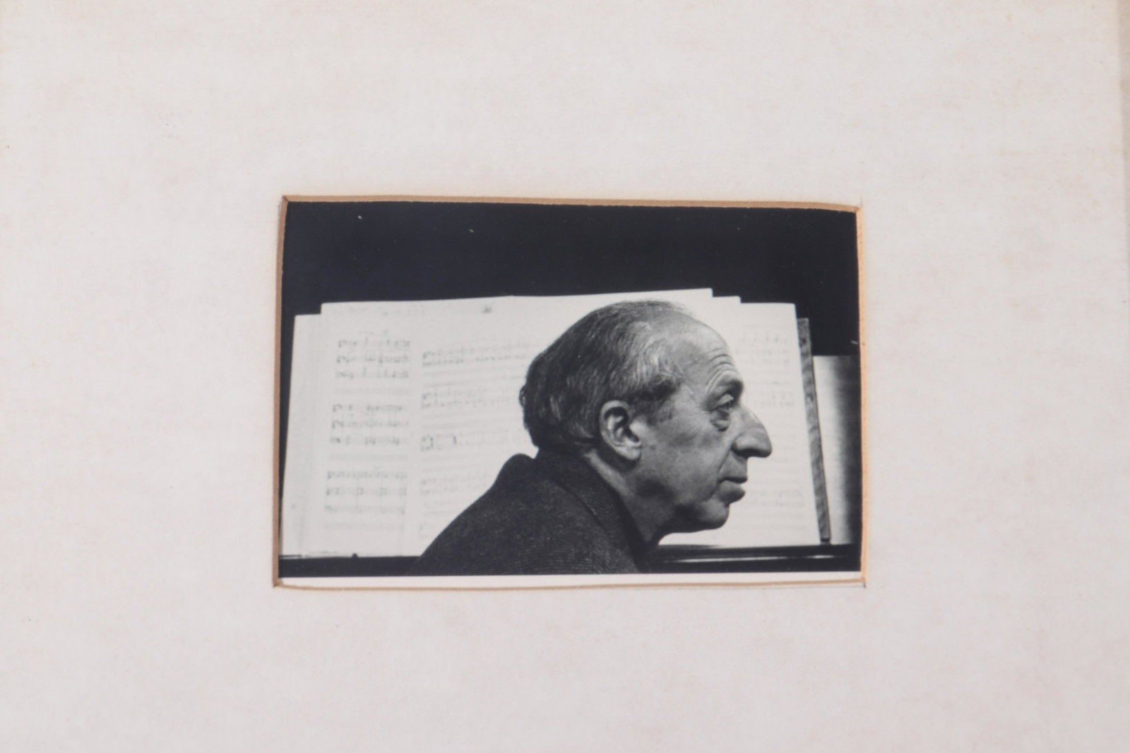 Aaron Copland Framed Autograph And Image: Framed autograph and image of composer and conductor Aaron Copland, circa 1980, signed “For Marty” and within a later frame. 15” H x 12” W.