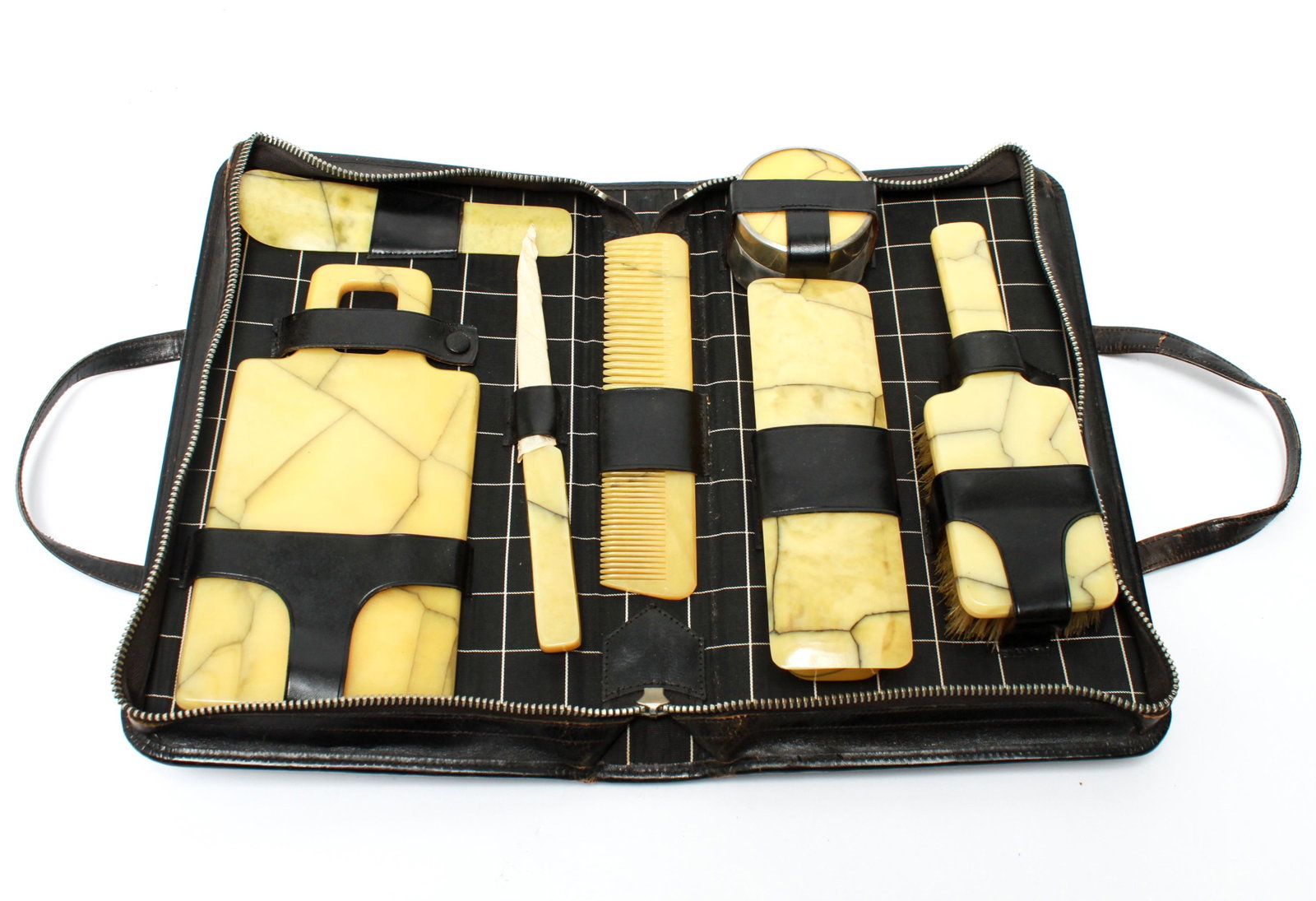 Vintage Dupont Celluloid Vanity Set with Case: Vintage Dupont marbleized celluloid vanity set in custom fitted monogrammed case, comprising a hand mirror, shoe horn, nail file, comb, small jar, hairbrush, and lidded box, monogrammed 'EES'. Mirror: