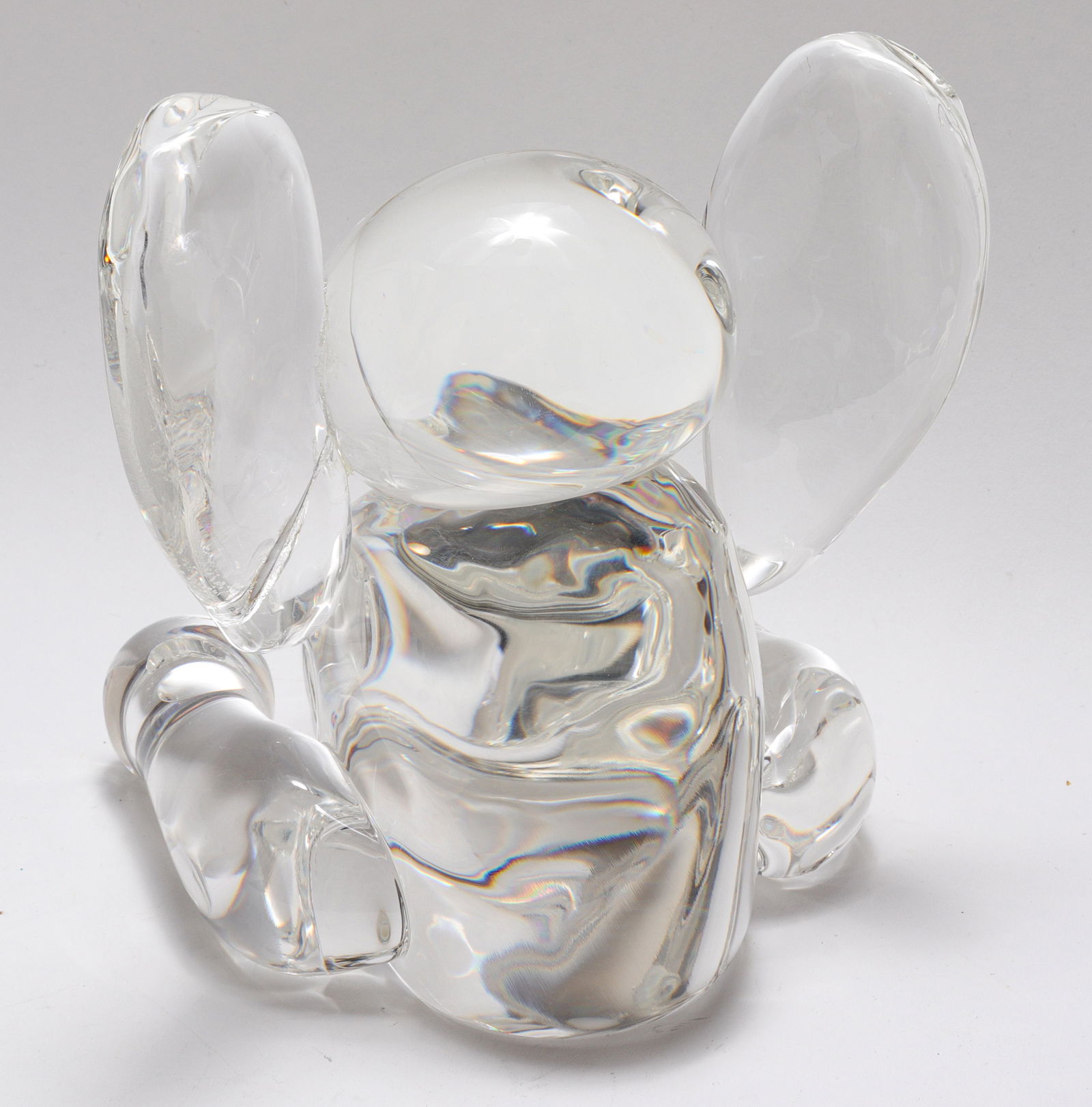 Steuben Glass Elephant Figural Sculpture: Steuben large glass elephant sculpture, signed underside. 6.5" H x 6" W x 6" D. Repaired break to proper left ear.
