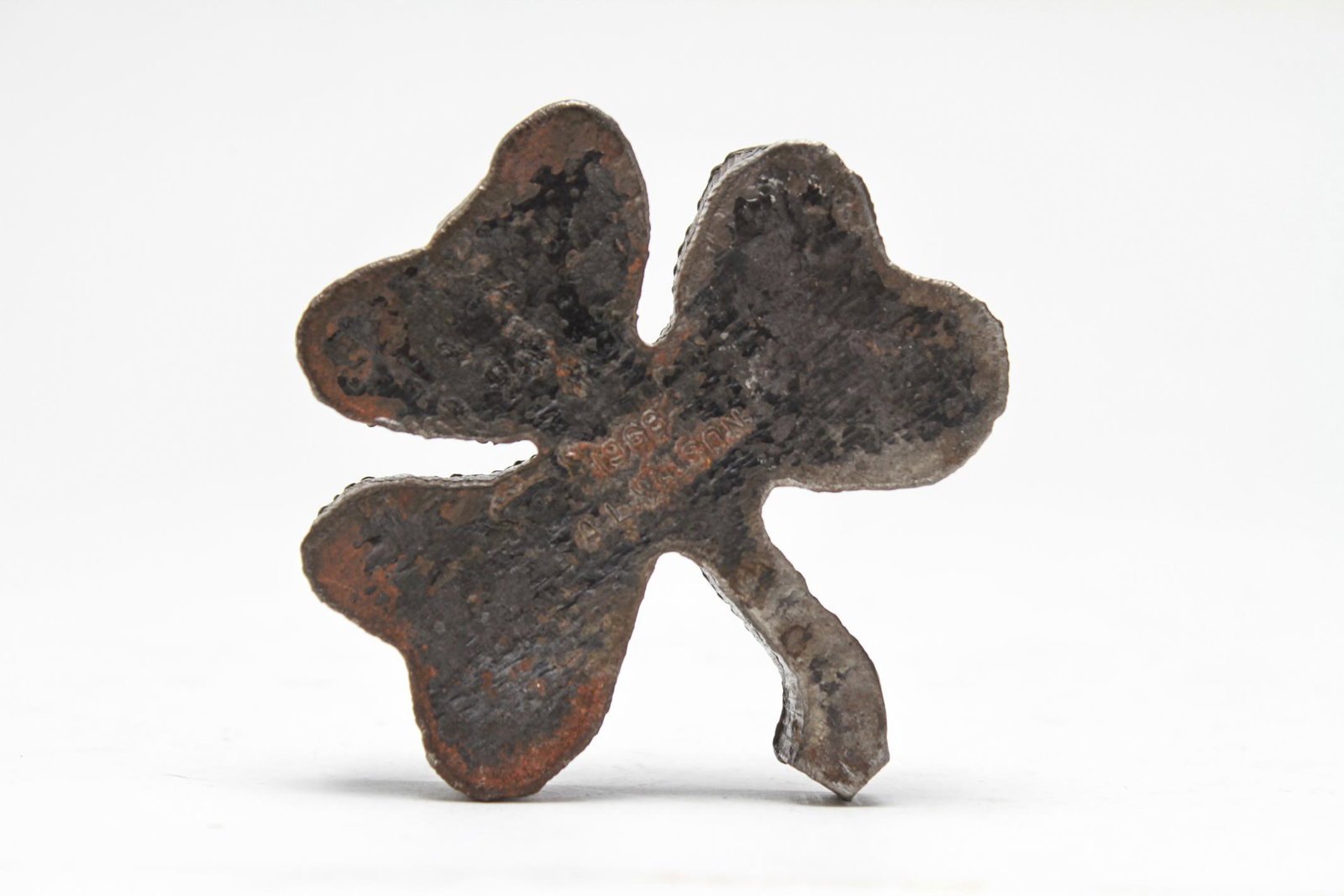 Alan Wilson Cut-Steel Paperweights Clover & Heart: Alan Wilson (American, 20th C.) cut-steel paperweights, two pieces, the first a clover form bearing impressed maker's mark and dated 1969; the second a heart, unmarked. Largest 2.75" L.